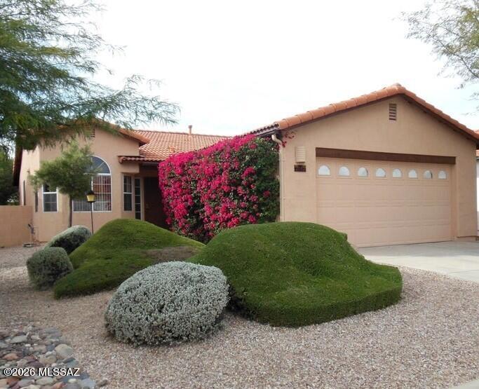 Discover privacy and convenience in this exclusive gated enclave of only 46 homes. Perfectly situated near the Williams Center, shopping, and dining, this open-concept gem features a spacious living/dining area and a sun-drenched breakfast nook facing the morning sunrise. The versatile den easily converts to a 3rd bedroom. Retreat to the primary suite with private patio access or enjoy the lush backyard complete with a covered porch and two mature citrus trees.