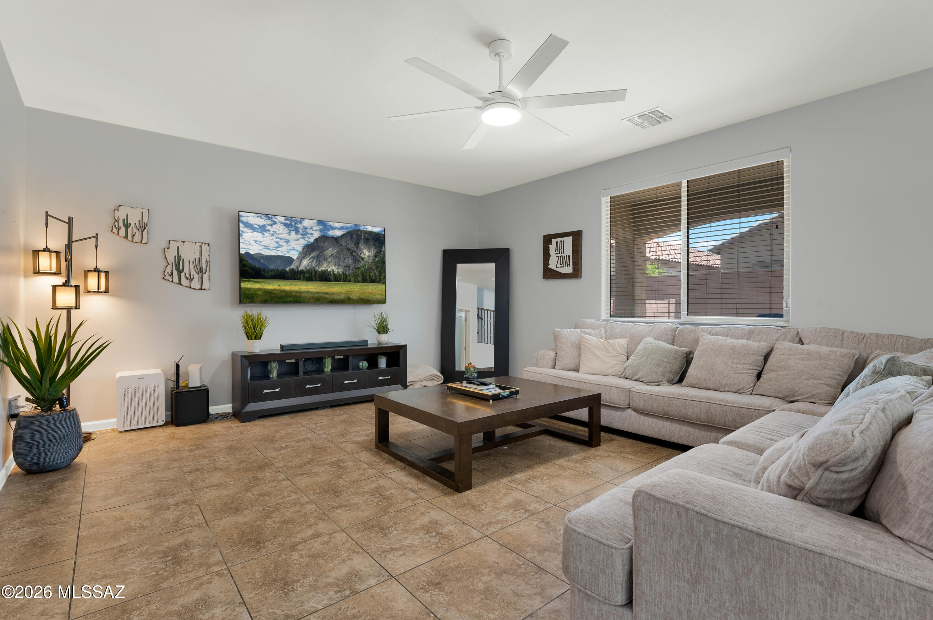 Beautiful 4-bedroom, 2.5-bath home with  den in Rancho Sahuarita! This home features a spacious floor plan with living and family rooms, no carpet, and low-maintenance front and back yards. The downstairs includes a versatile den, powder room, and open kitchen with a walk-in pantry, reverse osmosis system, and Water-Tec water softener. Upstairs features four bedrooms with walk-in closets, dual sink bathrooms, and a convenient laundry room. Energy-efficient upgrades include leased solar, sun screens, and a Tesla charging station in the 2-car garage. Close to parks, schools, shopping, and freeway.