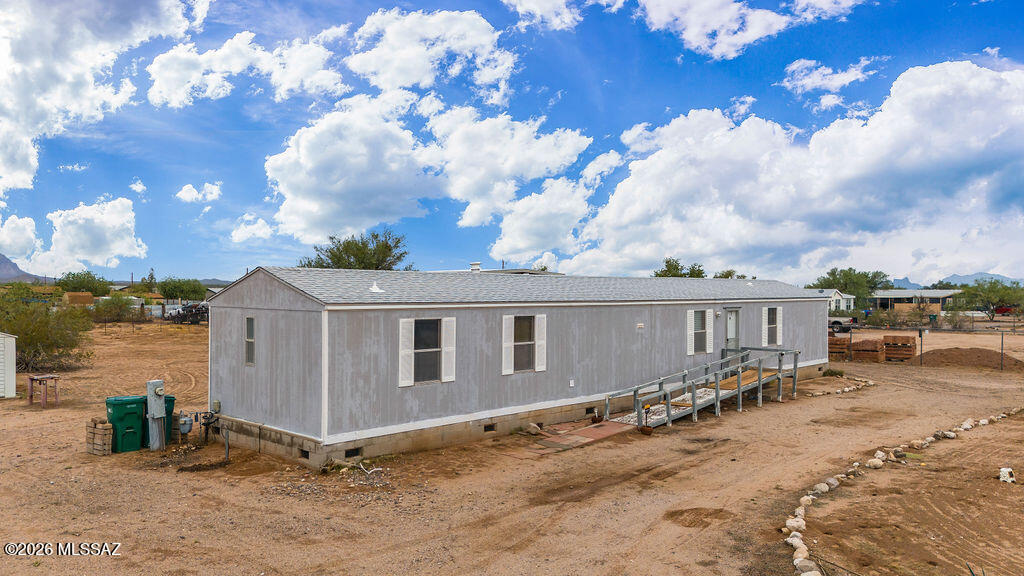 Range priced from $209,900 - $218,900.  Discover the freedom of wide-open spaces on this 1-acre property in Marana! This permanently affixed 1, 280 sq. ft. manufactured home offers the perfect opportunity for homeowners, investors, or anyone looking to enjoy rural living while remaining within convenient reach of Tucson.  The property features a utility/storage building, established septic system, and electrical service, providing a solid foundation for your vision. Whether you're looking for room to park your RVs, trailers, recreational toys, or simply enjoy the extra elbow room, this property offers the flexibility that's becoming increasingly difficult to find.  With no cramped subdivision feel, you'll appreciate the privacy, desert sunsets, so don't wait.