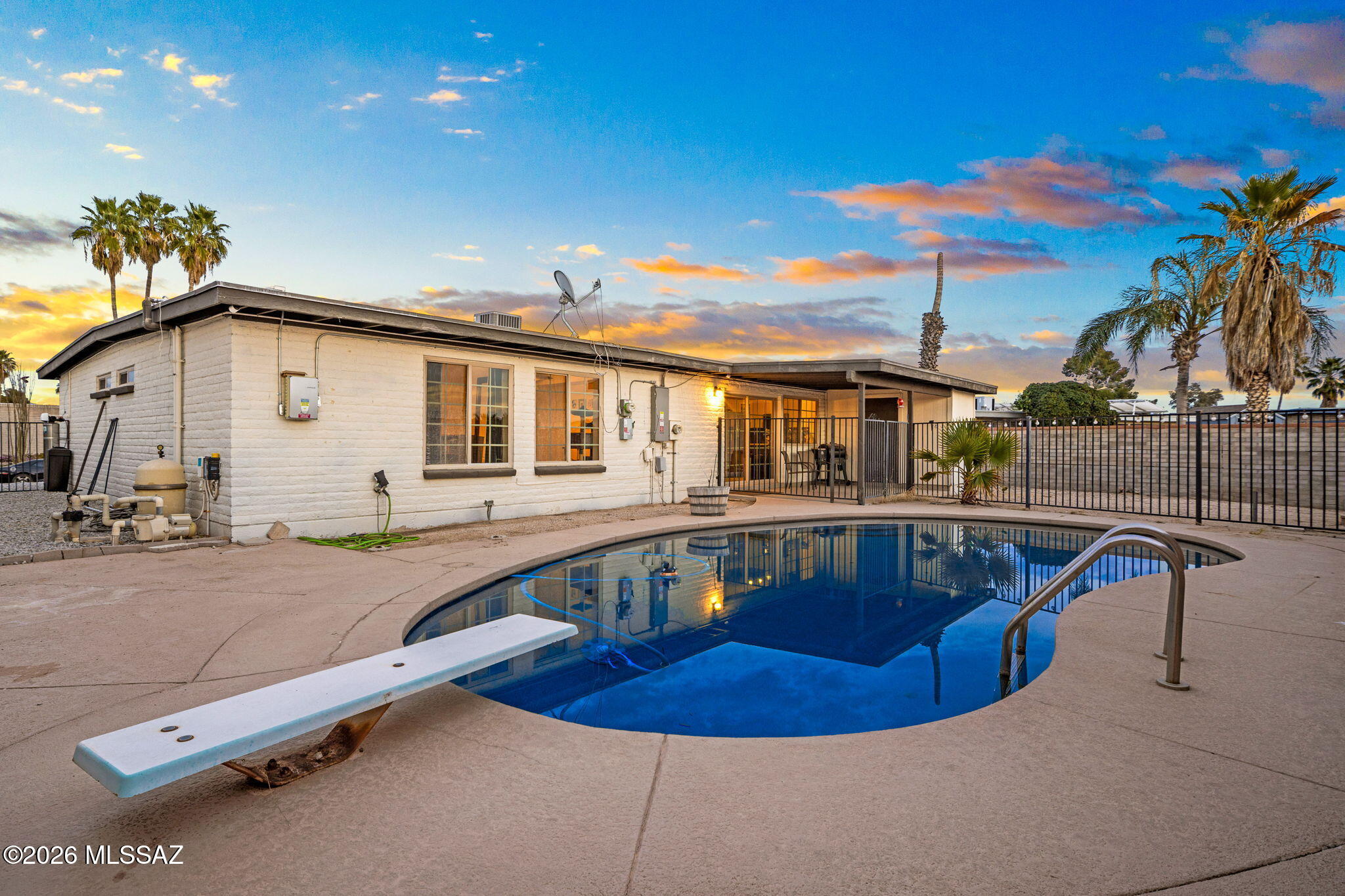 Welcome to this beautifully updated single story 4-bedroom, 2-bathroom home in a convenient east side location. Step inside to discover a fully renovated interior featuring updated finishes (including granite countertops and stainless steel appliances), stylish flooring, and a bright, open layout perfect for both relaxing and entertaining. The backyard is ready for your vision and features a sparkling pool for cooling off during warm Arizona days or hosting weekend gatherings. Leased solar panels makes for affordable and consistent utility bills. This gem is conveniently located near shopping, dining, schools and more and offers a terrific space to make the most of Tucson's beautiful weather year-round. This one checks all the boxes!