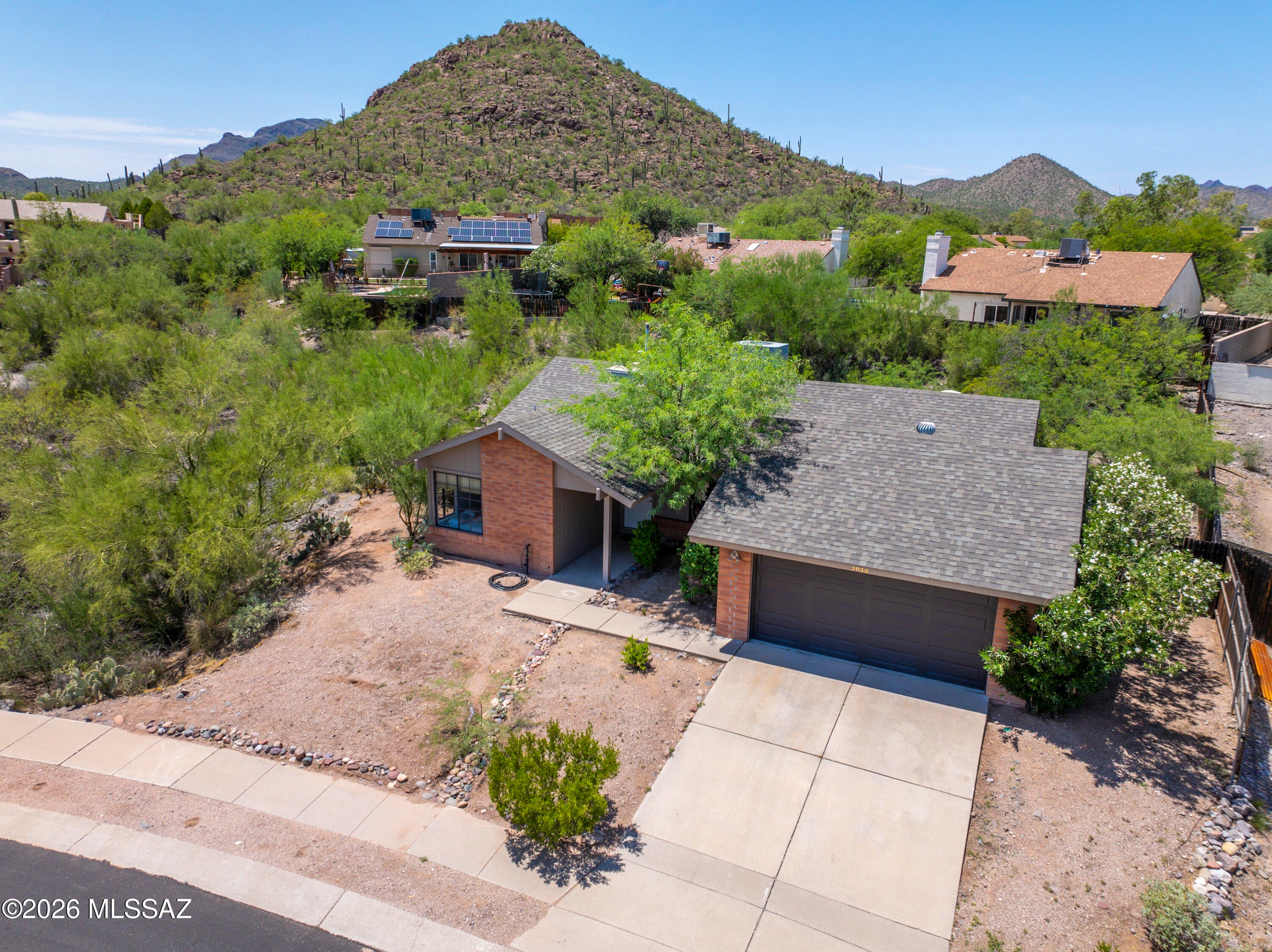 Welcome to this beautifully renovated 3-bdrm, 2-bath home on nearly one-third of an acre in the Tucson Mountains! With more than $70,000 in upgrades, this home offers exceptional quality & style, including 2'x2' floor tile & 2'x1' shower tile, quartz countertops, updated plumbing & light fixtures, smooth-finish plaster walls & ceiling, a finished garage, Trane HVAC system, newer appliances and no polybutylene piping. The expansive lot & mature vegetation provide privacy, tranquility & an opportunity to enjoy abundant Sonoran Desert wildlife. Ideally located near A Mountain, Tumamoc Hill, hiking & walking trails, U of A &  downtown. Just minutes from golf and activities at the JW Marriott Starr Pass Resort & Spa ! Perfect combination of modern upgrades, natural beauty  & convenience!
