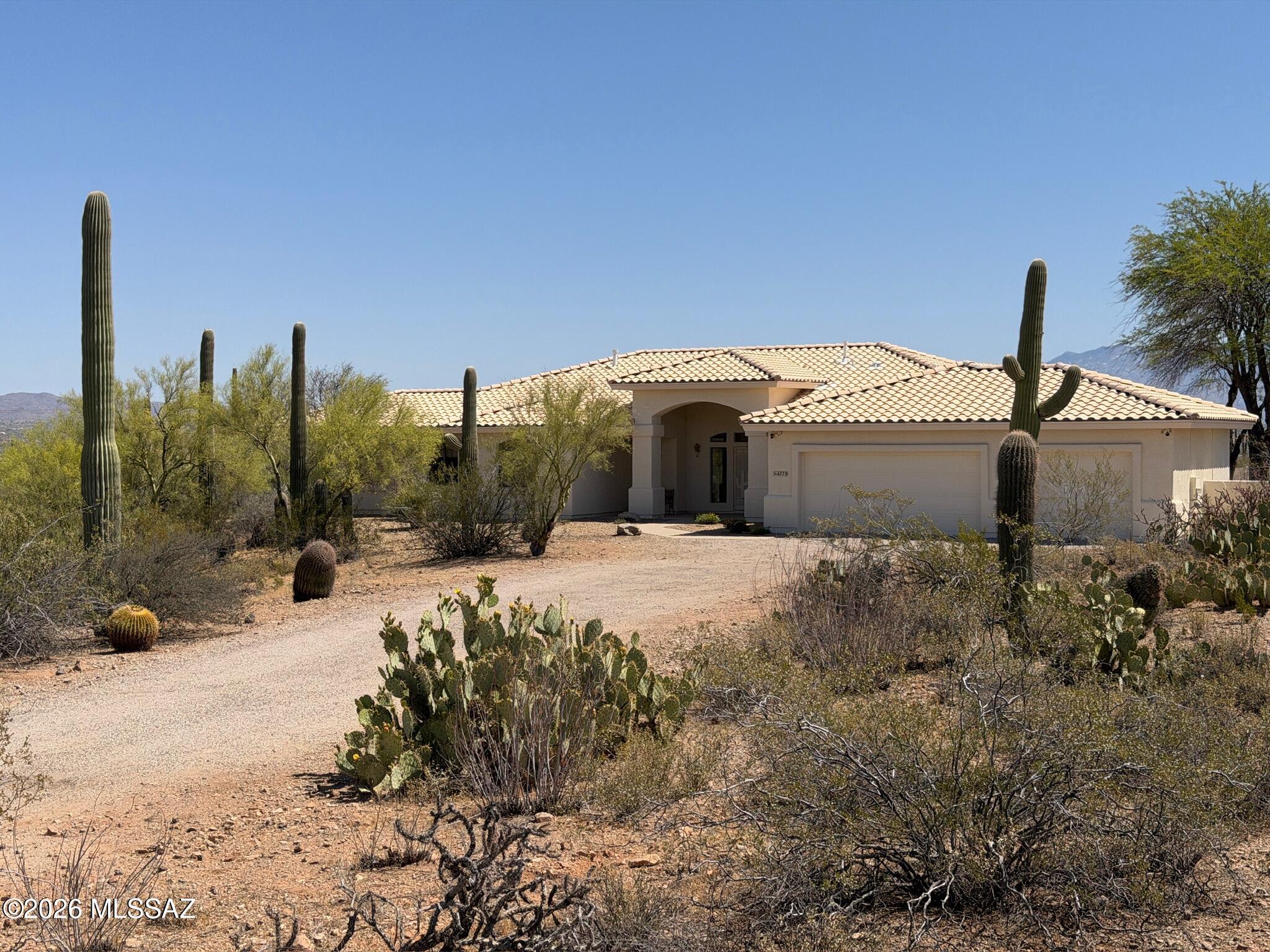 Must See' million $$ majestic panoramic views, 3300sf 4bd 3ba 3car garage home on 4ac with no HOA restrictions. Close but not too close to the freeway and shopping. Kitchen boast dble oven, gas-cooktop, microwave, island, granite counters, pantry & lots of cabinet space. Panoramic views of the Catalina mountains from your back patio and all east facing windows, patio has sunshades that are raised and lowered electronically. Sparkling pool, Zoned AC. Extra large laundry room with utility sink. Front load washer and dryer on pedestals included. Three car garage with attached storage cabinets. New paint inside and out, Exterior walls are 2 x 6 construction. Full building plans available. Outside security cameras included. Wrought iron fence is around the pool only.
