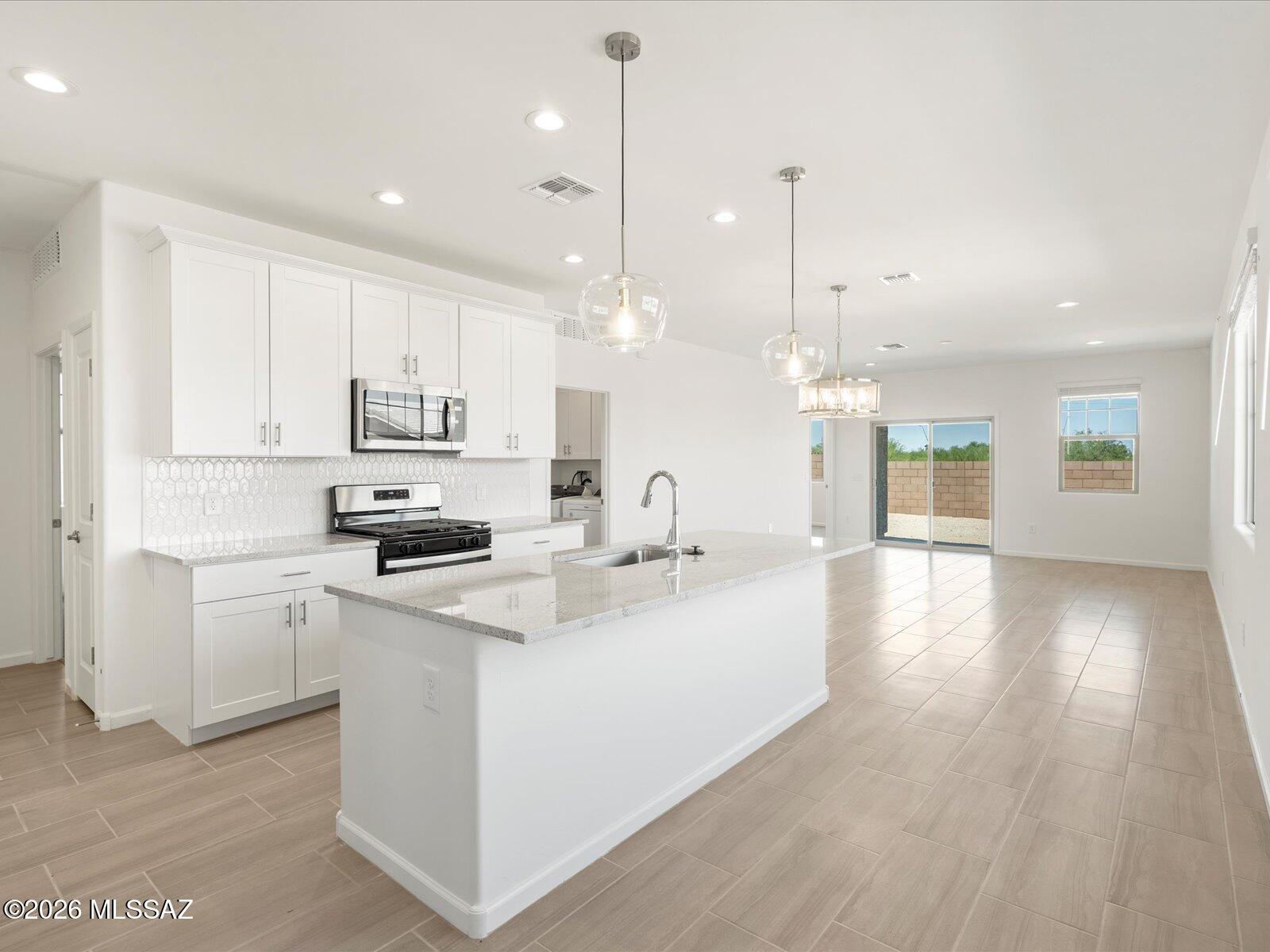 Step into effortless entertaining with this inviting 4-bedroom, 2-bath single-story home. The open-concept design keeps everyone connected, with a spacious kitchen overlooking the main living area--perfect for hosting or everyday living. Enjoy generous storage throughout and room to grow. Located in Sunset Crest at Ajo & Kinney, experience peaceful desert living with community perks like a playground, picnic areas, and shaded ramadas. Built with innovative, energy-efficient features for lasting comfort, savings, and peace of mind.