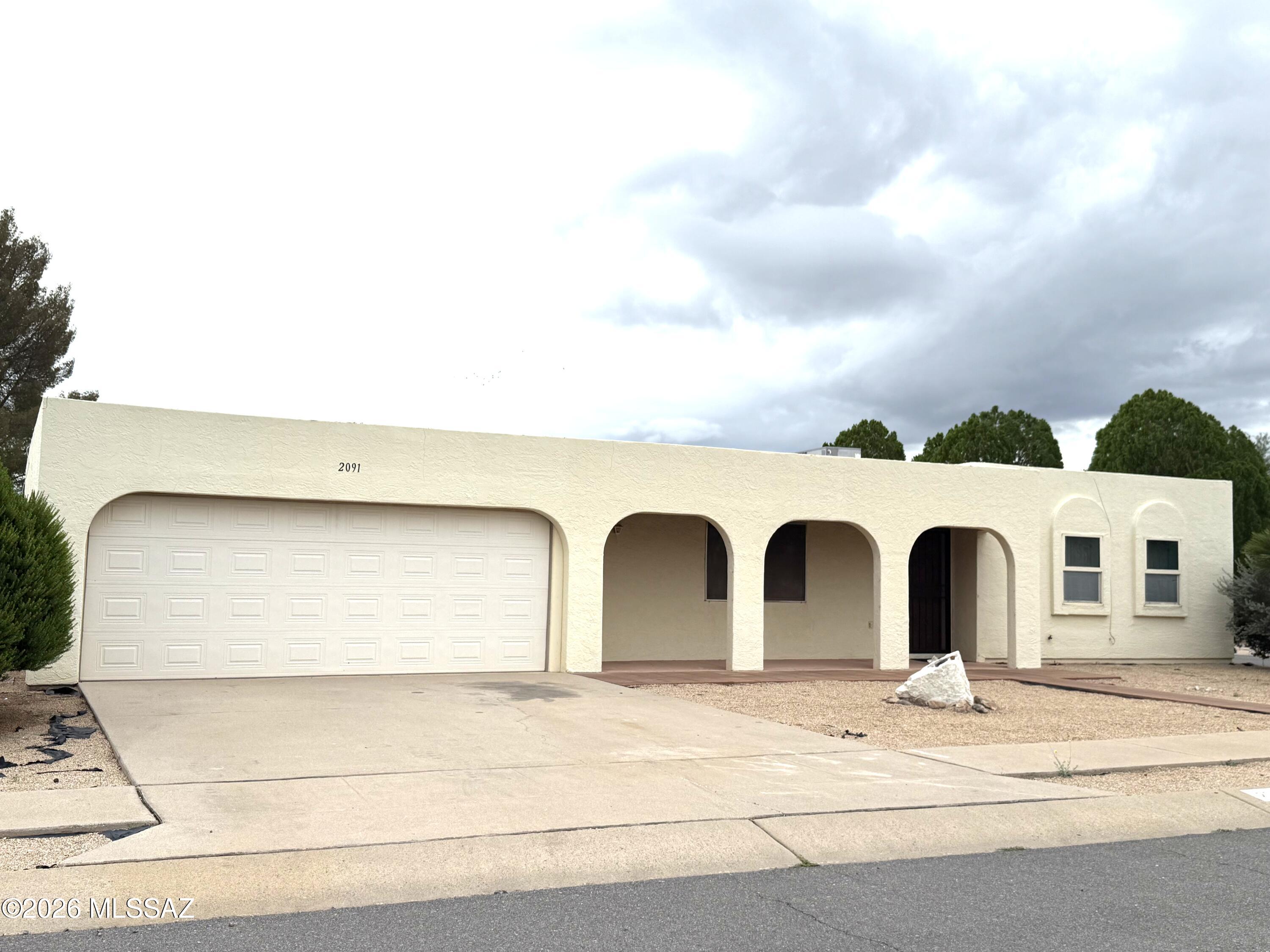 This home is set on a Corner lot, with a view of mountains from back yard/patio. The living room opens to the dining area with French doors out to the back patio and fenced in yard.  Versatile laundry area has room for crafts or seasonal things.  A two car garage has a deep closet for tools or equipment.