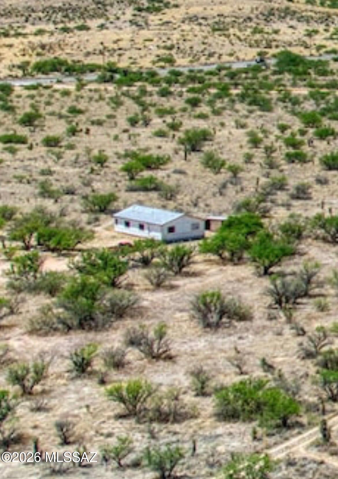 Breathtaking 10-acre horse property nestled between the Dragoon Mountains and Little Dragoon Mountains with stunning views of iconic Texas Canyon. This scenic property is served by Dragoon Water Company and showcases beautiful native desert vegetation, including mature mesquite trees and striking yucca. Improvements include a barn and a 3-bedroom, 2-bath manufactured home, offering comfortable country living with plenty of room for horses, recreation, or future possibilities. Enjoy the peace, privacy, and natural beauty of Cochise County. This property is in beautiful Dragoon. The Dragoon mountains surrounds it. It has Living room, eat in-kitchen, 3 bedrooms and 2 baths. It sits in 10 acres with a large older solid barn.