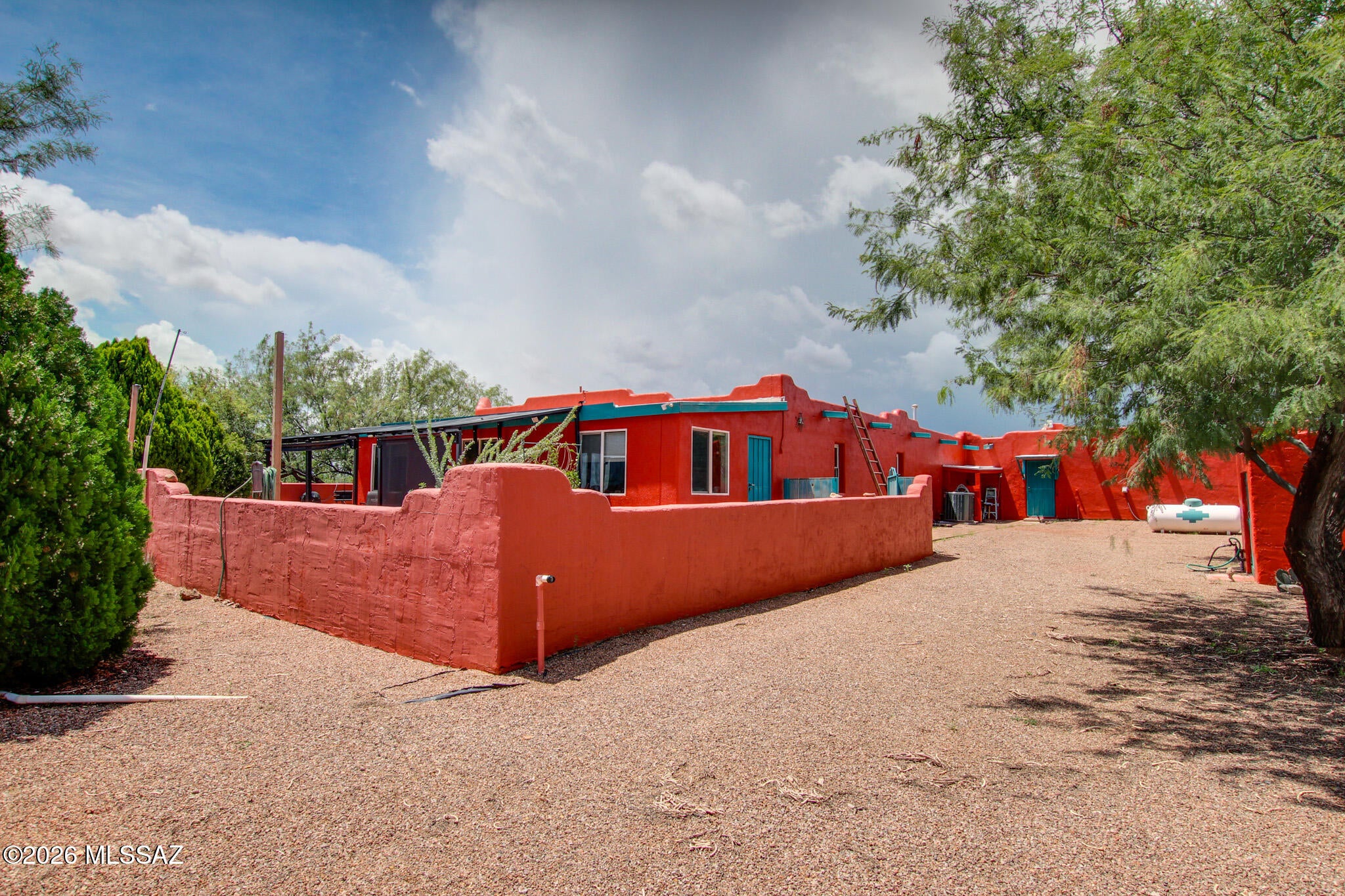Discover true Southwestern living on this stunning 12 acre Santa Fe-style horse property in Sierra Vista. This energy Efficient home features 3 bedrooms, 3 baths, warm architectural charm, and sweeping mountain views in every direction. Ideal for equestrian lifestyles, the land offers space, privacy, and endless potential. Enjoy an attached three-car garage plus a detached garage perfect for equipment, workshop, or additional storage. This property delivers the freedom, comfort, and scenery buyers love.