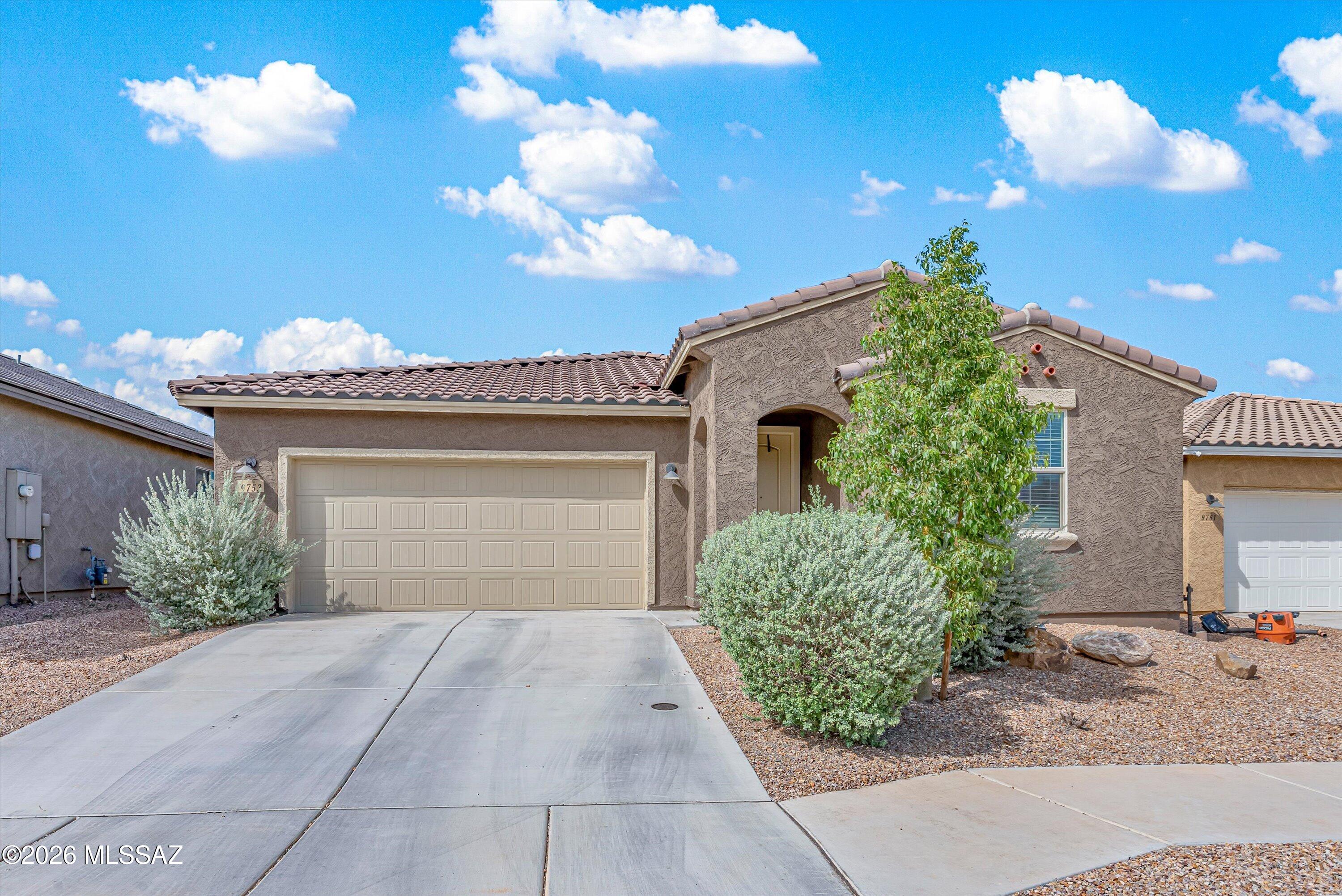 Well-appointed home with designer-inspired finishes located in the desirable and highly sought-after Saguaro Trails community. This 3 BD/2 ½ BA/2,022 Sq.Ft property offers an inviting floorplan featuring an open-concept family room off the kitchen, dining area, laundry room & den with built-in shelving. The chef's kitchen is sure to impress with a large island with sink & breakfast bar, beautiful white quartz countertops, dark wood cabinetry, stainless steel appliances & walk-in pantry. Spacious primary suite features a spa-like bathroom with separate soaking tub, walk-in shower, dual vanities & walk-in closet. Backyard is designed for easy living with turf, covered patio, paver sitting area & mature landscaping. Saguaro Trails offers an impressive array of amenities including community.. .... trails, parks, pool, recreation center, splash pad, dog park, beach volleyball, basketball court & more. Highly rated Vail School District! This home is move-in ready and offers the perfect blend of style, comfort & community amenities.