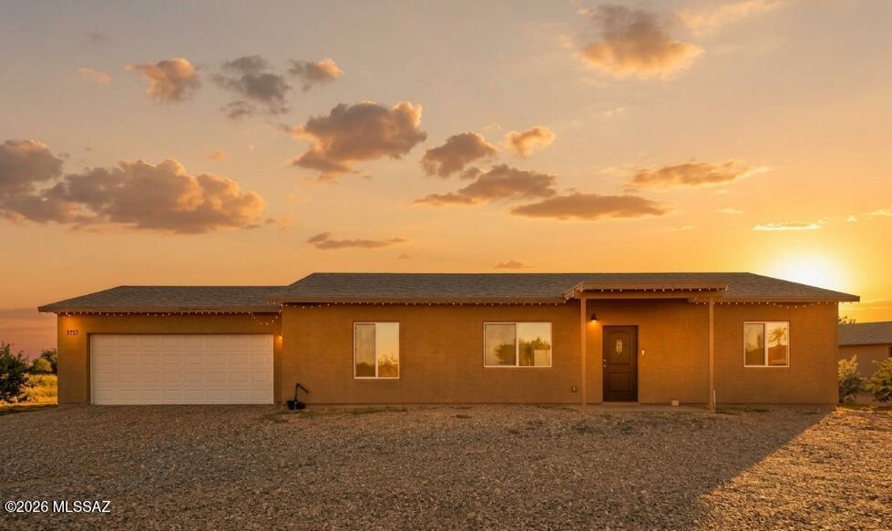 A RARE find in Tucson! Nestled on a HUGE 1-acre lot, this beautiful 2024-built home is ready to move in. Offering 3 beds, 2 baths, and a 2-car garage. The interior exudes modern finishes w/ high ceilings, abundant natural light, recessed lighting, a neutral palette, & concrete flooring t/out. You'll love the seamlessly flowing open layout for everyday living & entertaining! The eat-in kitchen boasts built-in appliances, granite counters, white shaker cabinets, & sliding doors to the back. The main bedroom has a walk-in closet & a private bathroom for added comfort. EXPANSIVE BACKYARD! The covered patio is where you can relax while enjoying fantastic mountain views. Generous open space offers endless possibilities for additional structures or outdoor amenities. Make this yours! Agent/Owner