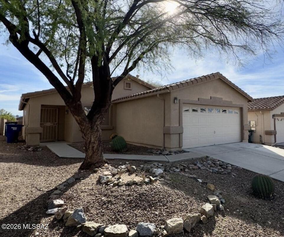 Investor opportunity in the desirable Greater Rita Ranch area! This tenant-occupied 3-bedroom, 2-bath home offers immediate rental income with a lease in place through March 2027, making it an ideal turnkey investment. Priced below market, this 1,385 sq. ft. home features 3 bedrooms, 2 bathrooms, vaulted ceilings, wood laminate flooring throughout the living areas and bedrooms, tile in wet areas, a low-maintenance turf backyard, and a spacious 2-car garage. All kitchen appliances convey for added convenience. Located within the highly sought-after Vail School District and close to shopping, dining, parks, freeway access, and major employers like Raytheon and Davis Monthan. This is an excellent opportunity to add a quality, income-producing property to your portfolio.