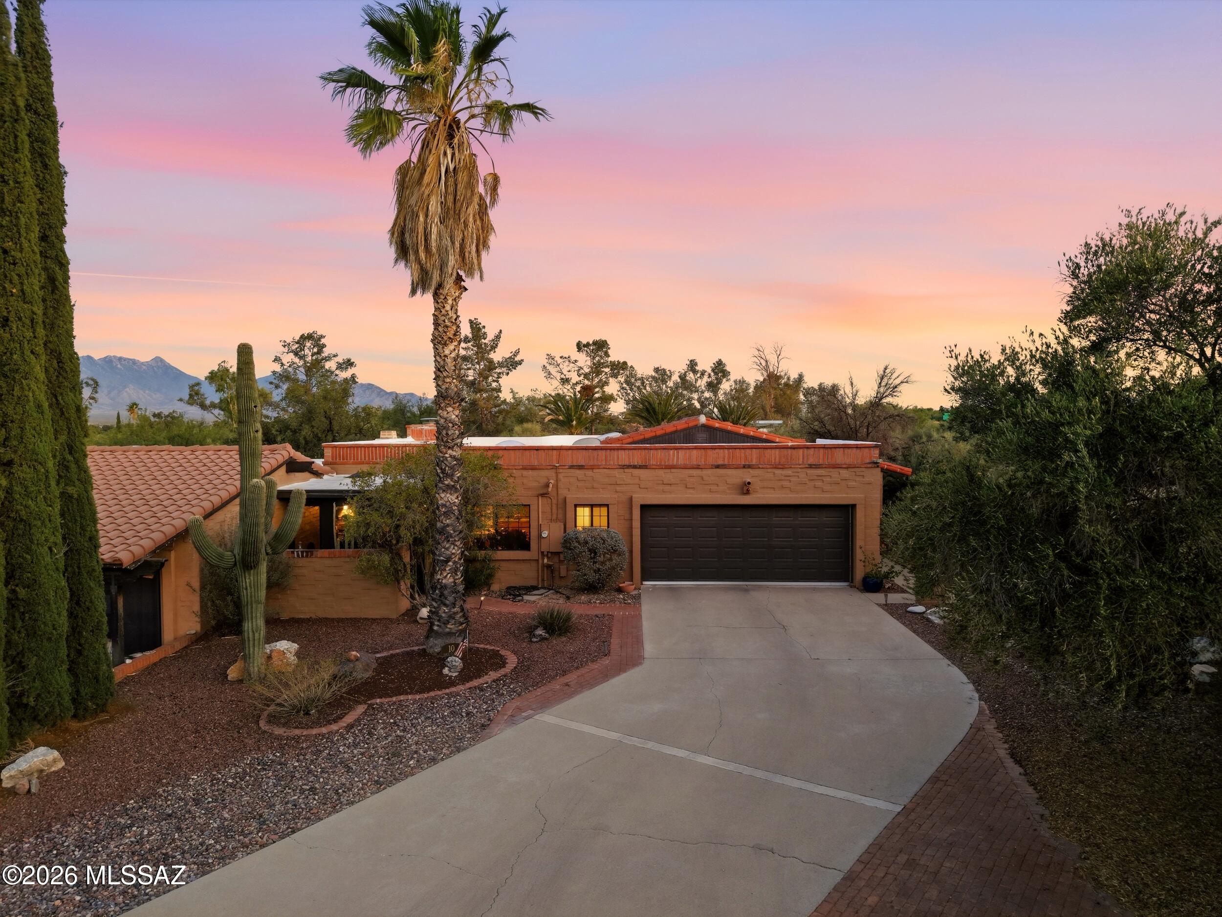 Range priced $375K to $400K.
NOT AN AGE RESTRICTED COMMUNITY, yet benefits of all the age restricted amenities! 
This beautifully maintained Green Valley home offers a warm, peaceful atmosphere with thoughtful design and inviting living spaces throughout. Every room has its own purpose and character while still flowing seamlessly together to create a comfortable and functional home.
The spacious living room welcomes you with rich hardwood flooring and abundant natural light from multiple skylights and a solar tube, creating a bright and airy environment.
The kitchen comes fully equipped with all appliances included in the sale, offering convenience and functionality for everyday living. Also the kitchen has beautiful Quartz countertops and a new garbage disposal! The primary bedroom provides a quiet retreat with hardwood flooring and easy access to the outdoor space.
Two additional bedrooms offer flexibility for family, guests, or a home office, each with their own private outdoor space.
The bathrooms are well maintained and conveniently located for comfortable living offering a tub and shower combo in the guest bathroom and separate large shower and soaking tub in the primary bathroom.
One of the home's most unique features is the variety of private patio spaces tucked throughout the property. These unexpected outdoor retreats create peaceful areas for relaxing, entertaining, gardening, or simply enjoying Arizona's beautiful weather.
The large backyard features mature landscaping and a producing lemon tree, along with plenty of room to enjoy outdoor living in the sought after North Green Valley subdivision. 
The HOA is only $56 per month and offers a community pool area! Situated minutes from major shopping and I-19 access for convenient travel. 
This home has Green Valley Recreation (GVR) attached to the deed which gives access to the many fitness centers in Green valley that also offer social events, Artisan and educational classes, racquet sports and other clubs.