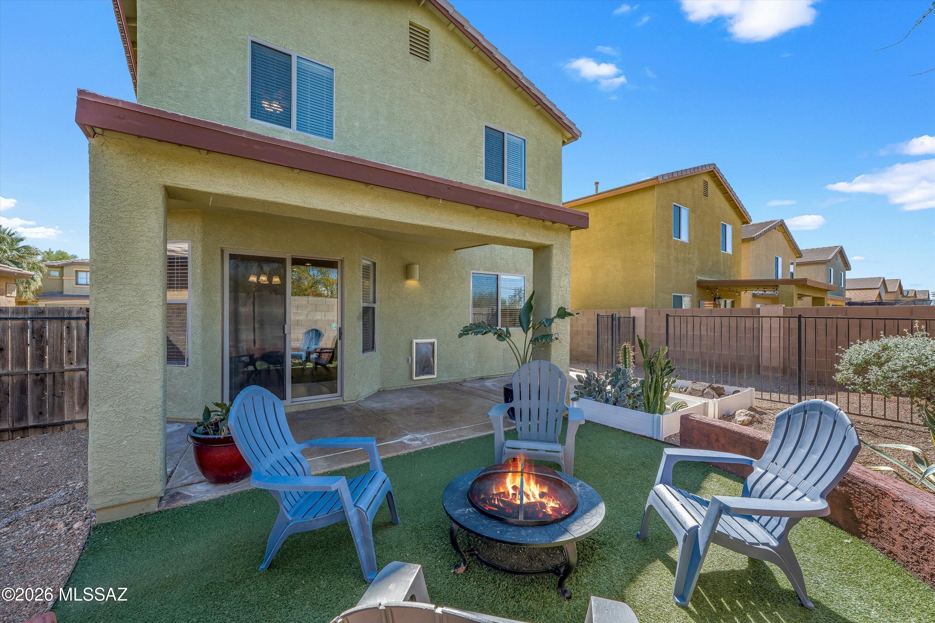 Welcome to a bright and inviting home with fresh interior paint throughout and an airy living room featuring soaring ceilings that create a spacious, open feel. The functional layout makes everyday living easy, with convenient upstairs laundry and a large, comfortable primary suite offering a relaxing retreat.

Step outside to a backyard designed for gathering, complete with a cozy fire circle and a large dedicated dog run for your four-legged companions.

Major updates include a new roof (2024) and HVAC replaced in 2020, providing peace of mind.

Ideally located near Davis-Monthan Air Force Base, Tucson International Airport, and the University of Arizona Tech Park, this home is a great opportunity for first-time buyers or military buyers seeking comfort and convenience.
