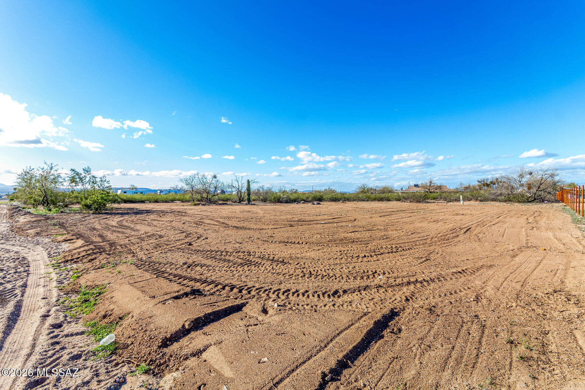 Huge 1+ acre lot right off of a paved road in beautiful Sahuarita! This lot has electric and water onsite. Clearing already started. Easy access. Ideal location for your future home or investment. No HOA. Plenty of room for your RV, animals, and homestead ideas. Horses and manufactured homes welcome! Large Saguaro onsite will be transported off lot and does not convey with property. Lot lines are approximate. Buyer to verify all.
Owner related to Listing Agent.