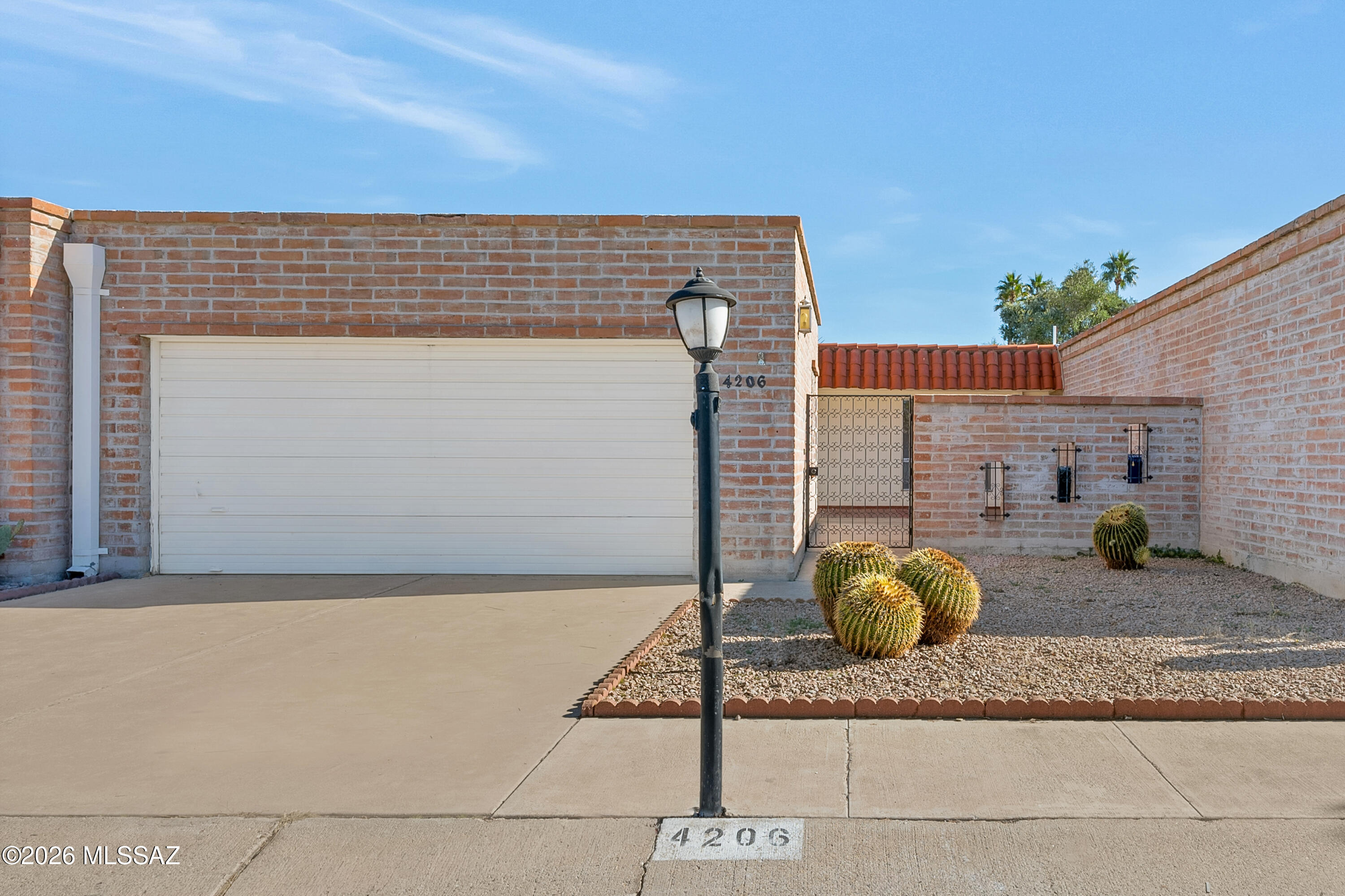 Exceptional value on this beautifully renovated burnt adobe townhome in a prime central Tucson location. Featuring 2 bedrooms, 2 baths, an open-concept floor plan, updated kitchen and baths, luxury vinyl plank flooring, modern finishes, 2-way fireplace, spacious gated courtyard, and 2-car garage. Low HOA with access to the community pool and spa. Minutes from Tucson Mall, hospitals, shopping, dining, grocery stores, and The Loop. A rare opportunity in today's market of this quality, location, and price point.