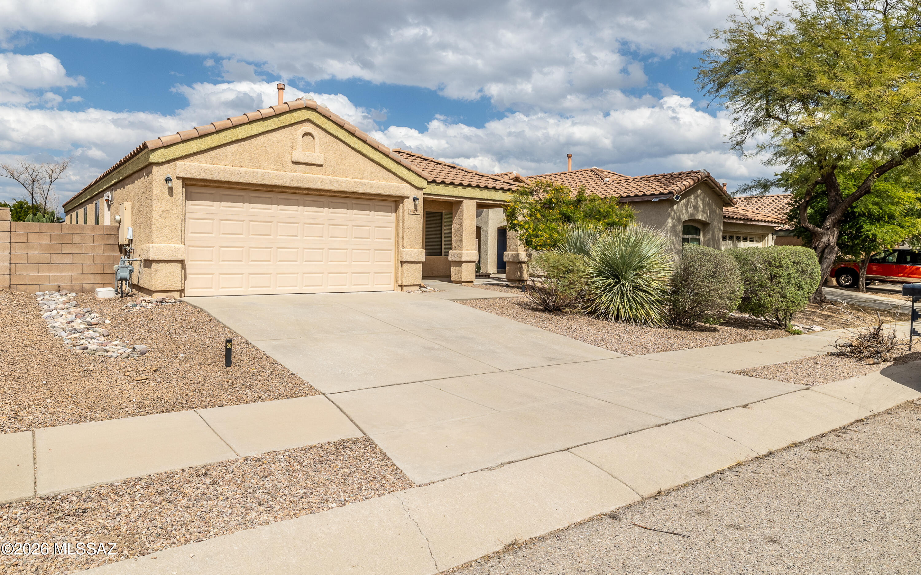 Now is your chance...come see this move-in ready 4-bedroom single-story home in the desirable Desert Willow Estates neighborhood. The home features a split floor plan, two living room spaces, and a backyard laid out with turf and a garden area with fruit trees, providing flexible options for relaxing or entertaining. Conveniently located near award-winning Vail schools and shopping.  Easy commute to Davis Monthan AFB, Tech Park, airport, and Raytheon. Make your appointment to see it today.