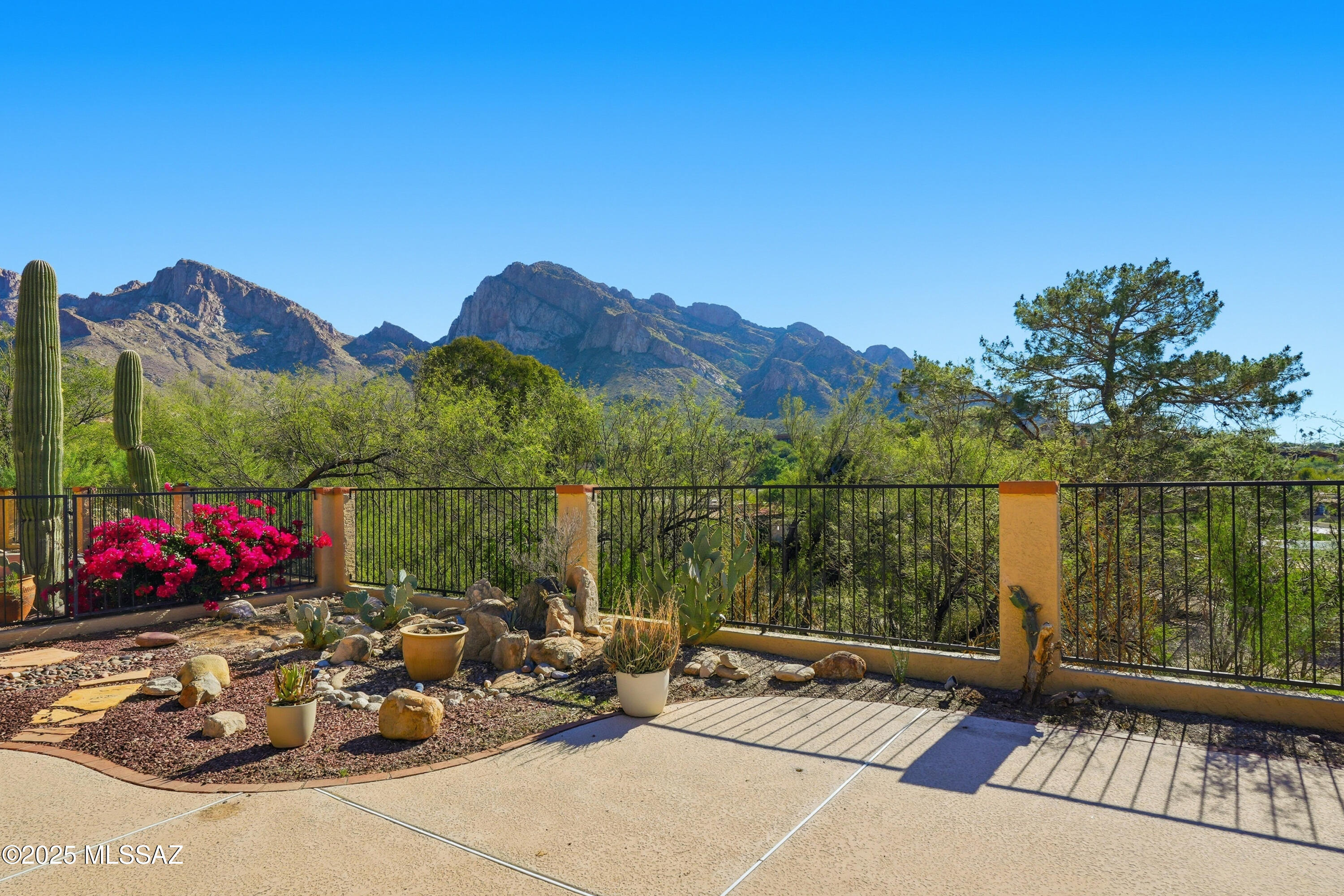 Views, Views, Views! Desirable El Conquistador Patio Home adjacent to the Hilton El Conquistador Resort. This 1,716 sq ft Patio Home offers a popular and functional floor plan, featuring 2 Spacious Bedrooms, a Versatile Den/Office, and 2 Bathrooms. Light-filled Kitchen with a Center Island and cozy Breakfast Area. Delightful Dining Room featuring a window that fills the space with beautiful natural light. Bright, spacious Living Room with cozy wood-burning Fireplace and Beautiful Mountain Views. Charming Front Courtyard. Stunning Pusch Ridge Mountain Views from a Private Rear Patio, complete with a relaxing In-ground Spa-perfect for enjoying Arizona living at its finest. Resort Style Living awaits you!