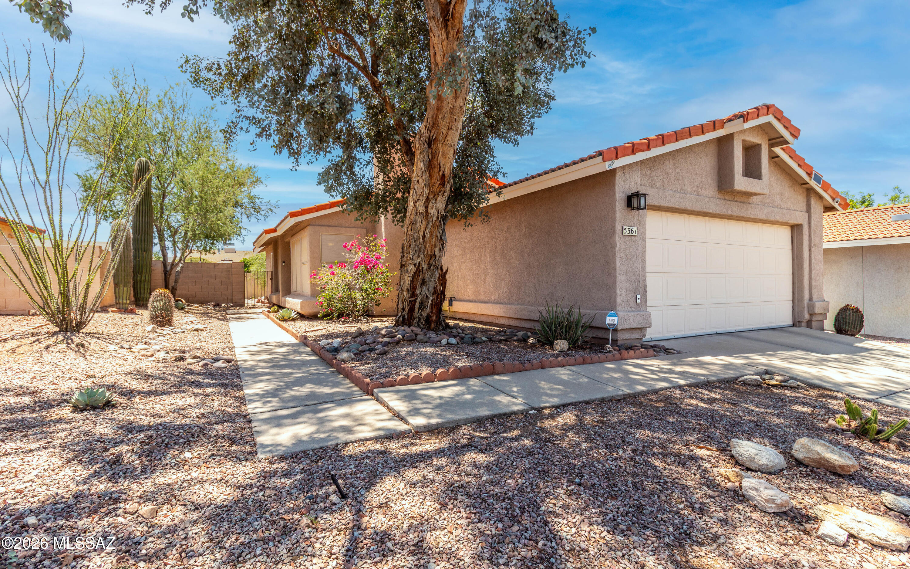 Take a look at this clean contemporary home which features a split bedroom floor plan, tile floors throughout (NO carpet!), an updated kitchen, and a newer HVAC. The open living room with vaulted ceilings is centered around a wood burning fireplace. Enjoy the pretty backyard from the shaded patio. Lots of storage is available with a 2-car garage and a shed. The neighborhood offers not one, but two community pools with super low HOA dues of only $44/month. Schedule a showing today!