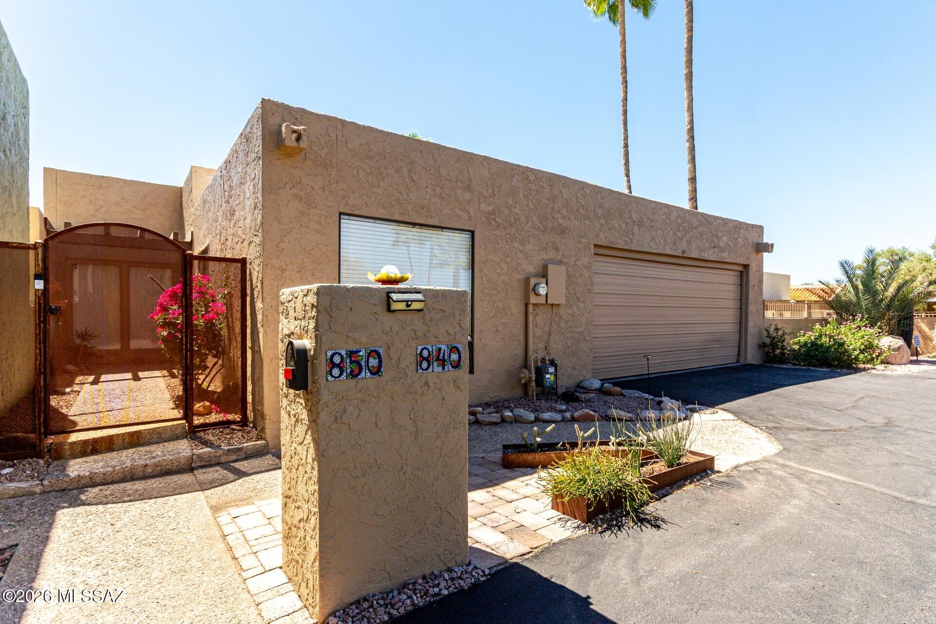You will love this unique multi-level floor plan designed by award winning architect John Campisano in El Mirador. This is the only stand-alone unit with 2154 sq feet of living including 3 bedrooms and 2 baths. Beautifully remodeled kitchen, large living room, formal dining area with 3 bedrooms and 2 baths. There are two gas fireplaces, one in the living room and one in the owner's suite sitting area. This home has 2-car garage with lots of storage. There are four patio areas, so nice for enjoying Tucson's lovely evenings. Prime location, Orange Grove and 1st Ave so you are so close to everything!