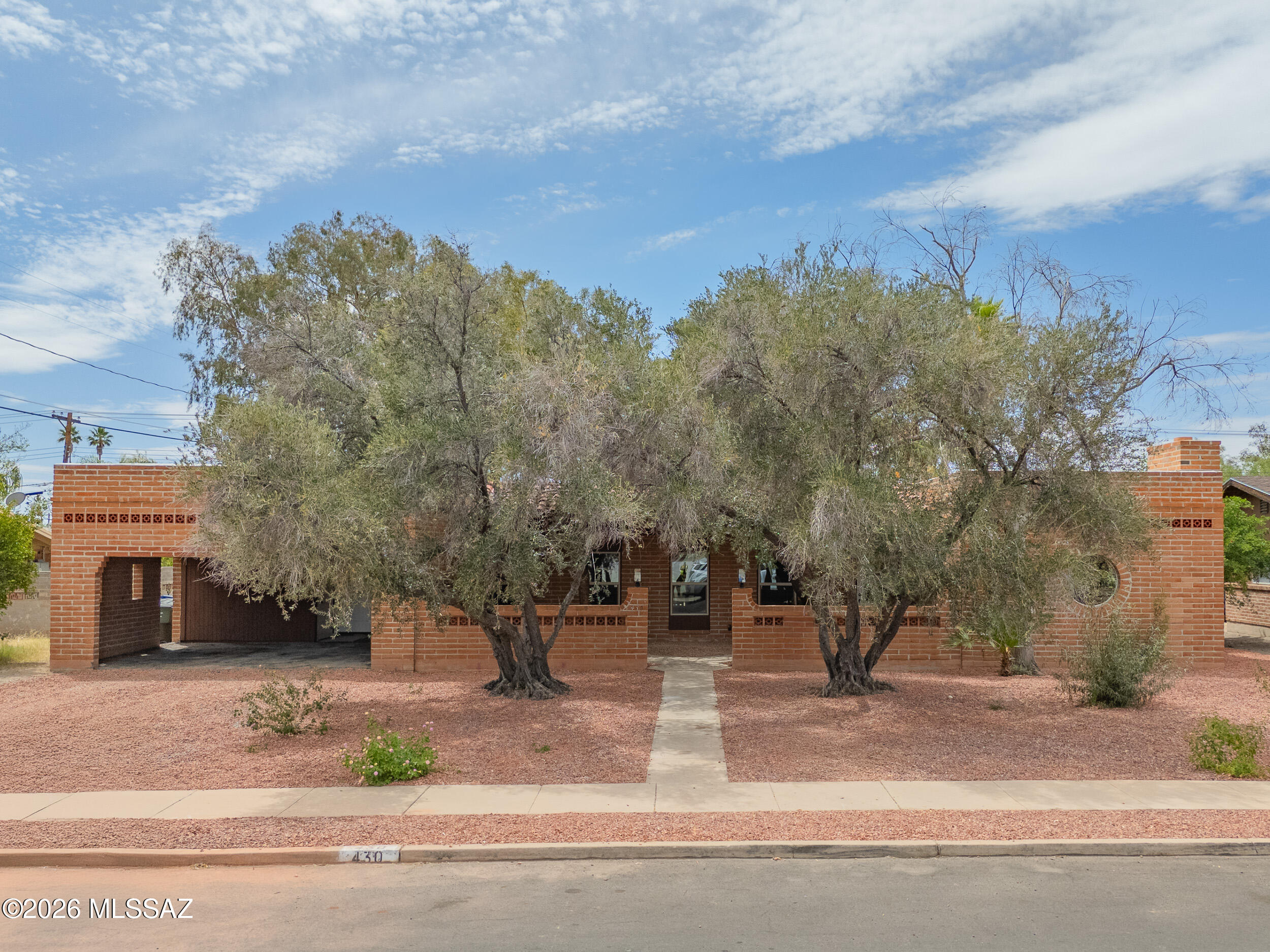 Introducing one of the most luxurious homes to hit the Tucson market--an unforgettable blend of bold design and timeless character. This stunning red brick residence showcases iconic statement windows that flood the home with natural light, perfectly complementing the dramatic black wood-beamed ceilings. The fully reimagined kitchen features a unique, designer-inspired color palette that truly elevates the space and sets a new standard for Tucson living. Every detail has been thoughtfully curated for both style and comfort. Located in the heart of central Tucson, just minutes from top dining, shopping, and everyday amenities--this is a rare showstopper you don't want to miss.