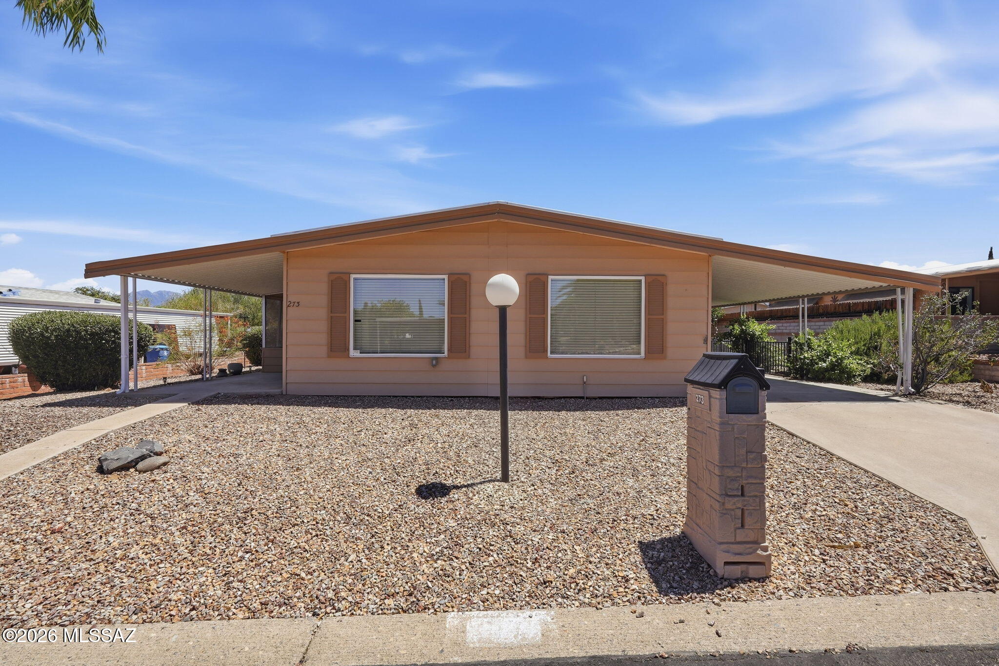 VALUE, LOCATION, PLUS FLEXIBLE POTENTIAL. THIS 2 BEDROOM, 2 BATH MANUFACTURED HOME LOCATED IN DESIRABLE PUEBLO ESTATES, 55+ RETIREMENT COMMUNITY, WHERE YOU OWN THE LOT.  IDEAL AS A SEASONAL WINTER GETAWAY, YEAR-ROUND OR AN INVESTMENT. THE EAST FACING SCREENED PORCH OPENS OUT TO A FENCED BACK YARD. BASED ON THE INFORMATION PROVIDED BY THE OWNER, THE FOLLOWING IMPROVEMENTS WERE MADE. WINDOWS REPLACED ON MAIN PART OF HOME. KITCHEN & HALL BATHROOM CABINETS REPLACED. NEWER APPLIANCES.  PRIMARY BATH SHOWER, GAS FURNACE, A/C, WATER HEATER, SECURITY DOORS EAST SIDE & CARPORT SIDE REPLACED.  LARGE WORKSHOP FOR TINKERING & STORAGE. HOA $65.00 MO. GREAT RECREATIONAL FACILITIES TO EXPLORE. OWNER ARE PROVIDING ASSURANT HOME WARRANTY PLAN FOR BUYERS AT COE. NO GVR, BUT AVAILABLE.