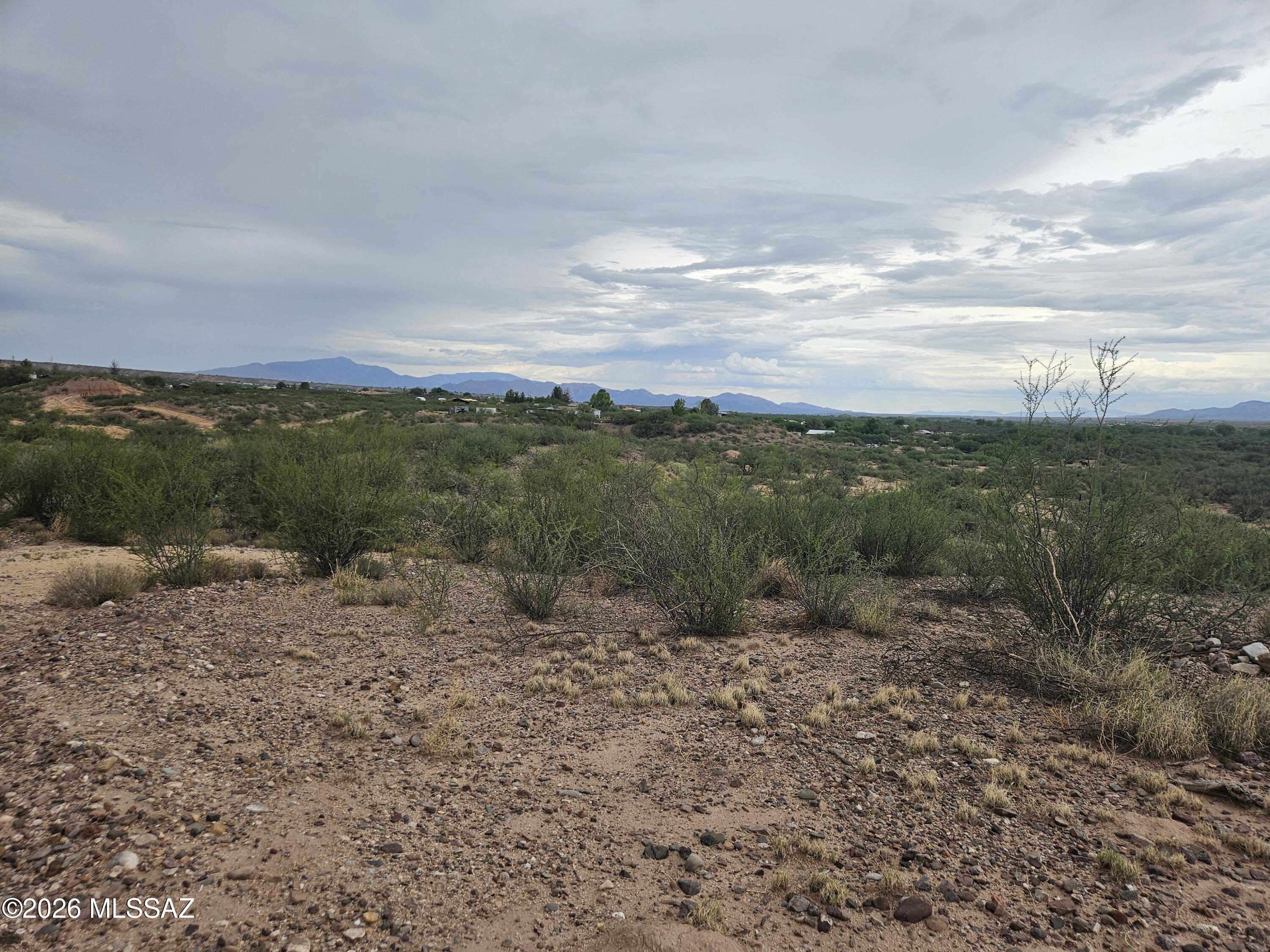 The subject property consists of five individual parcels in Cochise County, totaling approximately 80 acres. 
Residential property with 4 homes.
The terrain features about 20 acres of rugged, eroded hills and 60 acres of
relatively level land atop a hill, offering panoramic views of the Dragoon and Whetstone Mountains and the San Pedro River Valley. The property is a mix of residential, equestrian, and vacant land.
Parcel 1 124-23-008D 12.85 acres, contains a 1990 single-wide mobile home (1,280 sq ft) and a 2010 double-wide mobile home. Parcel 2 124-23-008C 14 acres, includes a 2002 Cavco doublewide (1,760 sq ft) and a 2000 park model (500 sq ft). This parcel is equipped with extensive horse facilities. Parcel 3 124-23-007C 23.34-acre lot with a 2008 hay shed and a well on site.