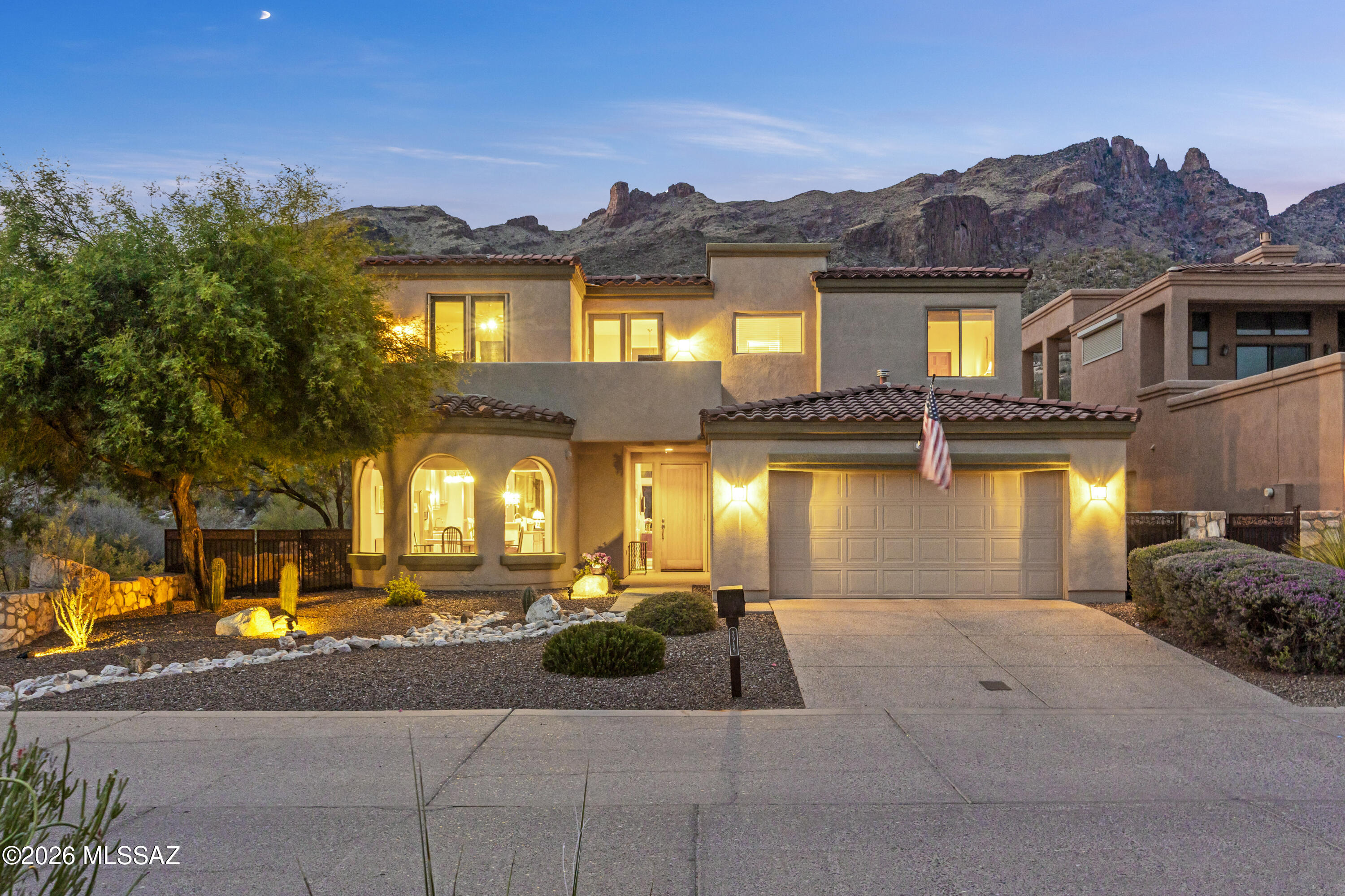 Positioned behind the private gates of the prestigious ''Summit at Finger Rock'' in the Catalina Foothills, this exceptional residence occupies one of the community's most desirable view lots, offering rare, unobstructed city and mountain vistas. Iconic Finger Rock rises dramatically above, while the Pontatoc Canyon Trail and Finger Rock trailhead are quite literally just beyond your backyard--providing direct access to some of Tucson's most coveted hiking trails. Backing to the protected expanse of the Coronado National Forest and adjoining a natural greenbelt, the property offers a rare combination of privacy, open space, and a seamless connection to the surrounding Sonoran Desert, with abundant wildlife and a true sense of tranquility. All of this, just minutes from the refined shopping and dining at La Encantada and the amenities of La Paloma Country Club--an increasingly rare offering where protected land, north/south orientation, lush natural desert and convenience all converge in the Foothills. Meticulously maintained as a seasonal residence by the original owners, the home encompasses approximately 3,032 square feet with five bedrooms and three bathrooms, thoughtfully designed with all primary living spaces on the main level for effortless day-to-day living. Upstairs, a private retreat offers elevated perspectives of the city skyline and surrounding desert landscape. Two spacious guest bedrooms, a full bath, and an inviting sitting area open to a view terrace that captures sweeping views extending all the way to Mexico on a clear day or after a few glasses of wine. Inside, soaring ceilings and expansive walls of glass create a light-filled interior that frame the home's extraordinary setting. A gas fireplace and wall of windows in the primary bedroom look out on the most dramatic natural desert- a view most can only dream to wake up to. The primary bathroom offers a walk-in shower, jacuzzi tub and an enormous walk-in closet w/attic access and storage.  Rolling window shades in the oversized living room provide comfort and privacy, complemented by a gas fireplace and generous wall space for art. The well-appointed kitchen features granite countertops, maple cabinets, a gas cooktop, and a center island with breakfast bar, along with a casual dining area that captures city views after sunset. The functional layout opens seamlessly to the main living areas, equally suited to everyday living and entertaining on a larger scale. Outdoors, low-maintenance desert landscaping complements a deep covered patio designed for year-round enjoyment--ideal for Tucson's signature indoor-outdoor lifestyle. Thoughtfully designed, well-constructed, and meticulously maintained, this is an ideal "lock-and-leave" opportunity for a luxurious vacation home or refined downsize within one of the Foothills' most sought-after gated communities not to be missed. (Most Furniture is available by a separate bill of sale.)
