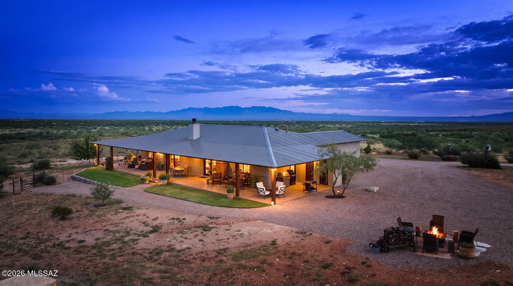 Welcome to Rancho De Mi Hombre, a remarkable 38-acre private ranchette nestled within the gated Dragoon Mountain Ranch at approximately 4,700 ft in elevation. Set amid the high grassland desert of SE Arizona, the property offers breathtaking 360-degree views across the San Pedro Valley, with the magnificent Dragoon Mountains rising as a dramatic backdrop. The peaceful setting, expansive open space, & incredible Arizona skies create a sense of privacy & tranquility that is becoming increasingly rare to find. At the heart of property is a beautifully designed 2,200sf custom ICF home, built in 2022 for exceptional energy efficiency & comfortable living with fiberoptic internet service. The open-concept floor plan features 2 bedrooms, 2.5 baths, & a soaring 12-ft vaulted ceiling great room.... and approximately 1,300 SF custom ICF home, This main residence has approximately 1,300 SF of wraparound porches that invite you to enjoy the views and Arizona's wonderful weather. The chef's kitchen features an induction cooktop and a double oven, farmhouse sink, quartz island, and butler's pantry, while the great room centers around a stacked-stone woodburning/gas fireplace with a beautifully carved mesquite mantle. The spacious primary suite offers dual barn-door walk-in closets and a generous walk-in shower.
Just steps away, the 660 SF masonry guest house, built in 2000, provides comfortable accommodations with a kitchen, bath, laundry, garage, and approximately 800 SF of wraparound porch. Whether used for guests, family, or a private retreat, it complements the main residence beautifully.
The property is thoughtfully set up for horses and livestock, with perimeter and cross fencing and approximately 30 acres available for grazing. Equestrian amenities include a 36' x 44' steel horse barn with three-sided shelter, a 12' x 20' concrete hay-storage slab, a 60' fully sided round pen, a 56' portable panel round pen, two portable buildings on concrete slabs, and ample room for trailer parking.
Water is a significant asset, with a private well producing approximately 30 GPM and two 1,500-gallon storage tanks. A private gate at the residence adds to the property's privacy, while the community also provides an emergency well and helipad.
As part of Dragoon Mountain Ranch, it encompasses approximately 15,000 acres and nearly 50 miles of community-maintained dirt roads for horseback riding, hiking, biking, and exploring. Access to Coronado National Forest is approximately 1.5 miles away, while historic Cochise Stronghold and the Dragoon Mountains provide a spectacular setting rich in history and natural beauty.
The experience continues after sunset. The night skies are extraordinary. Stars seem to go on forever, and the moon casts its light across the mountains and open grasslands, creating a peaceful and unforgettable desert landscape.
Rancho De Mi Hombre is more than a home or ranch--it is a place to slow down, breathe deeply, and enjoy the beauty of Southeast Arizona. With its custom energy-efficient home, guest accommodations, exceptional water resources, equestrian facilities, privacy, sweeping views, and remarkable natural surroundings, this is a truly special property in an equally special setting.