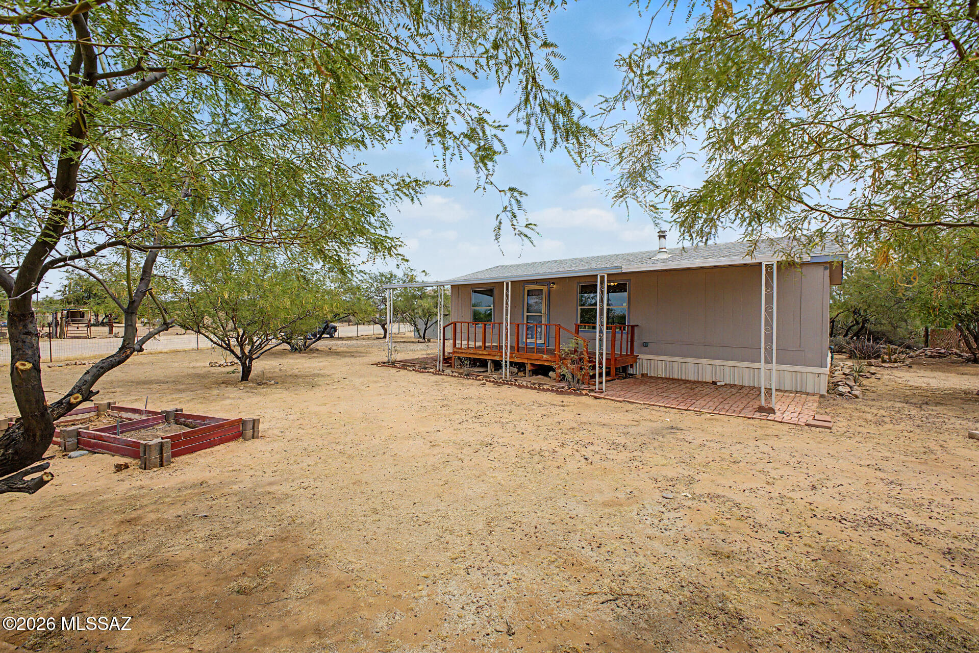 List Range Pricing, Seller will accept or counter offers between $234,700 - $244,700 *** Welcome to country living with modern comfort! This beautifully updated 3-bedroom, 2-bath manufactured home sits on a fully fenced 1-acre lot, offering space, privacy, and endless possibilities. Inside, you'll find stylish modern updates throughout, creating a warm and inviting atmosphere that's move-in ready. The property features a versatile Tuff Shed currently used as a home office, perfect for remote work, hobbies, or extra storage. A freestanding carport/workshop area provides ample room for projects, equipment, or covered parking. Enjoy gardening in the fenced garden area and take advantage of the convenience of city water. With plenty of room for pets, toys, RVs, and outdoor activities.