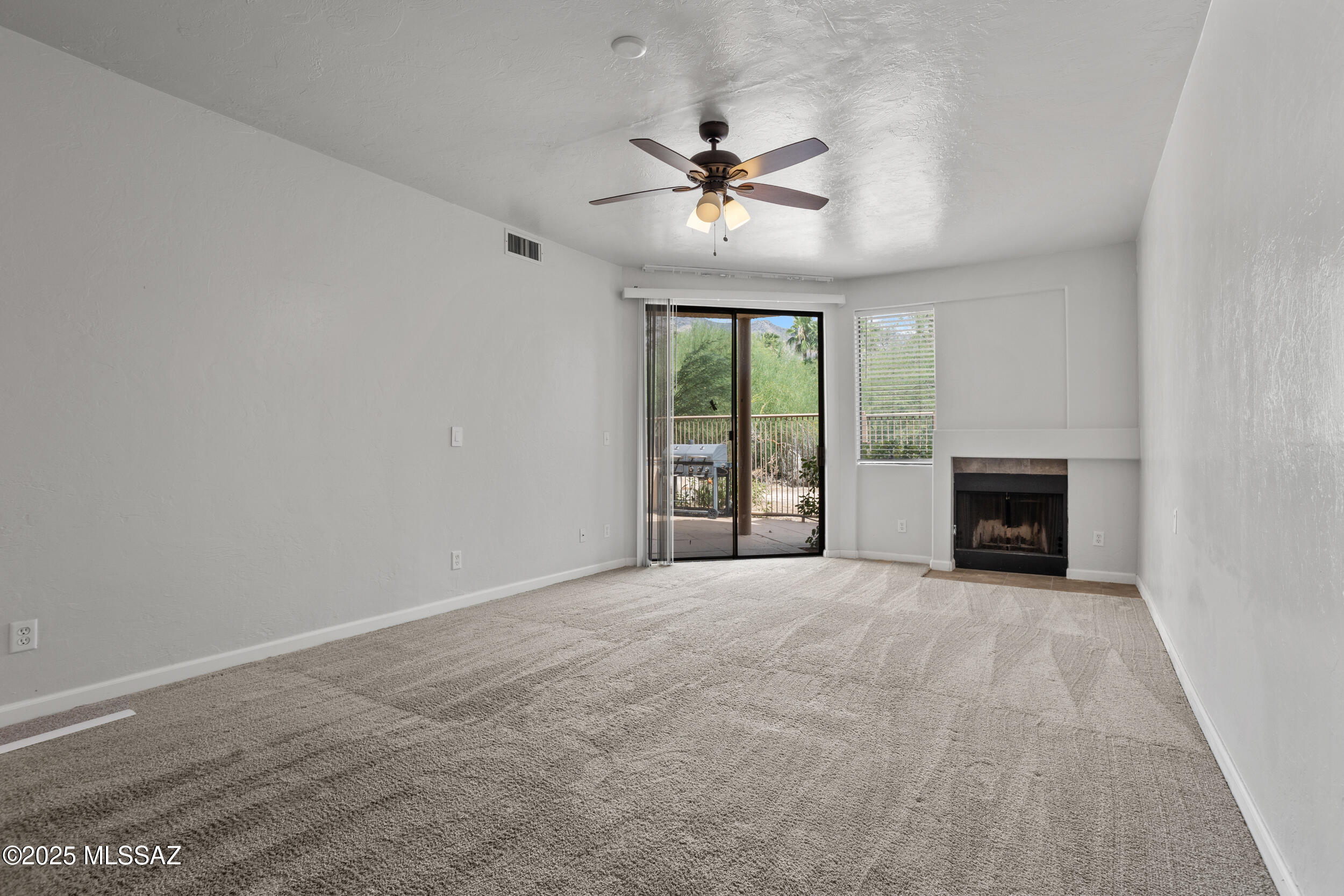 This beautiful 2 bed 2 bath condo is move in ready. Centrally located inside the community, the pool is only steps away. Love being outside, then the back patio with mountain views is the place for you. Inside the home, the kitchen is light and bright with white cabinets, and the large living room flows from kitchen to patio. The guest bedroom and bathroom are at the front of the home providing privacy, with the primary suite at the rear with its own entrance to the patio. With in unit laundry, everything you need is in this spacious condo. Located off Swan and Sunrise, the surround amenities are within walking distance.