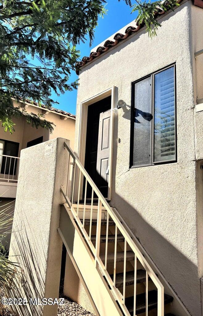Located in the highly desirable gated community of La Paloma, this beautifully maintained two-bedroom, two-bathroom condominium offers the perfect blend of comfort, style, and convenience.

Upon entry, a welcoming foyer leads you upstairs into a bright and airy main living area highlighted by soaring vaulted ceilings and abundant natural light. The expansive kitchen is filled with character and features sleek stainless steel appliances, generous cabinetry, and ample counter space--ideal for both everyday living and entertaining. The open layout flows seamlessly into a cozy living room centered around a modern fireplace, creating a warm and inviting atmosphere.... The thoughtfully designed split floor plan ensures privacy, with two spacious primary suites positioned on opposite sides of the home. Each bedroom includes its own private en suite bathroom, offering comfort and flexibility for guests, roommates, or family members. Additional features include an electrical panel upgrade, private laundry room and an attached one-car garage for added convenience and storage. Residents enjoy access to community amenities such as a sparkling pool area, scenic mountain views, and beautifully maintained grounds. Ideally located near restaurants, schools, shopping, and more, this home offers both a peaceful retreat and everyday accessibility in one exceptional package.