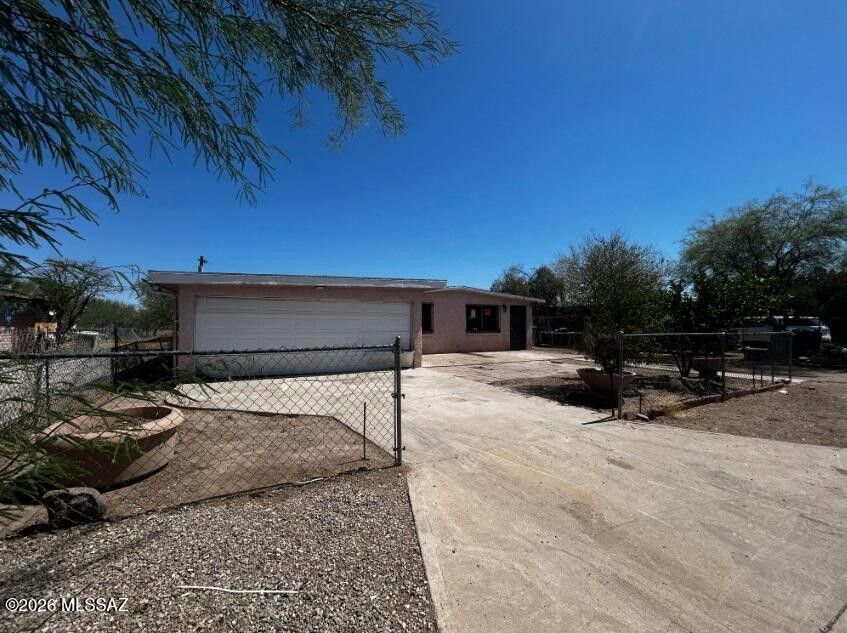 Handyman Special with tons of potential! Nice 3 bed 2 bath with 2-car garage in Tucson! Living area offers Saltillo tiles, wood-look flooring, ceiling fans, archway, deco column. Family room for entertaining guest. Kitchen features cabinetry, countertop, island and a range hood. Wrought iron doors and windows for security. Backyard with covered patio! Great fix and flip opportunity, excellent rental investment, or a great chance for a first time home buyer to build some sweat equity. Short term seller financing available with 10% down.  Financing for renovations is also available.  This property is being sold As Is. Seller will do no repairs. Buyer to turn on utilities at their own expense should they wish to have them on for inspections. Great Opportunity! Owner/Agent.