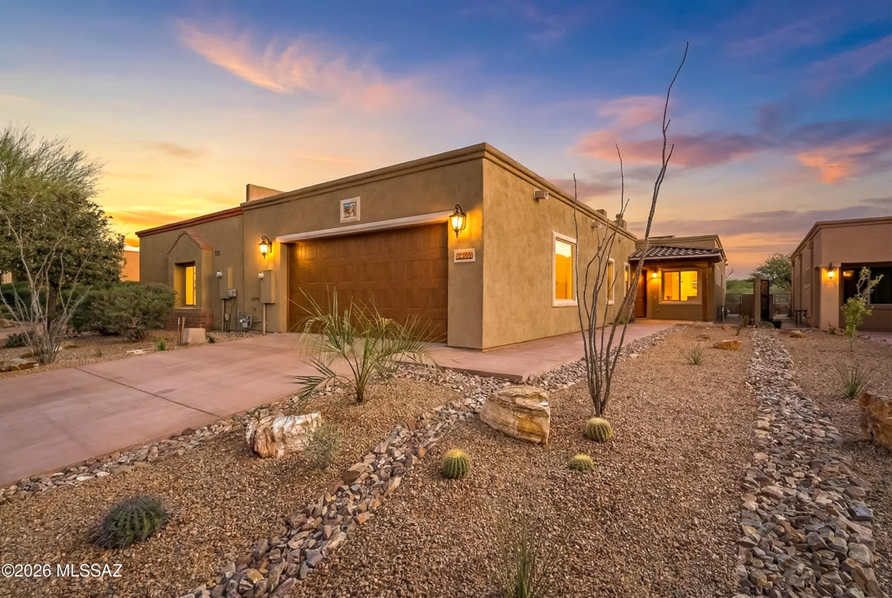 Refine living in Barrio de Tubac, where design meets elevated comfort. This meticulously crafted home is bathed in natural light w/ skylights placed to illuminate every space & create a warm, inviting ambiance throughout. At the heart of the home, a chef-inspired kitchen showcases stunning quartz countertops, blending elegance living & elevated entertaining. The intelligently designed floor plan offers 2 spacious bedrooms, 2 bathrooms & a versatile den that easily adapts to your lifestyle. Seamlessly transition outdoors to a stunning private patio, ideal for quiet mornings or gatherings in a serene setting. The oversized garage-nearly 200 sqft larger than standard-a built-in electric car charger. Every detail has been curated to deliver a lifestyle within Tubac's most desirable communities