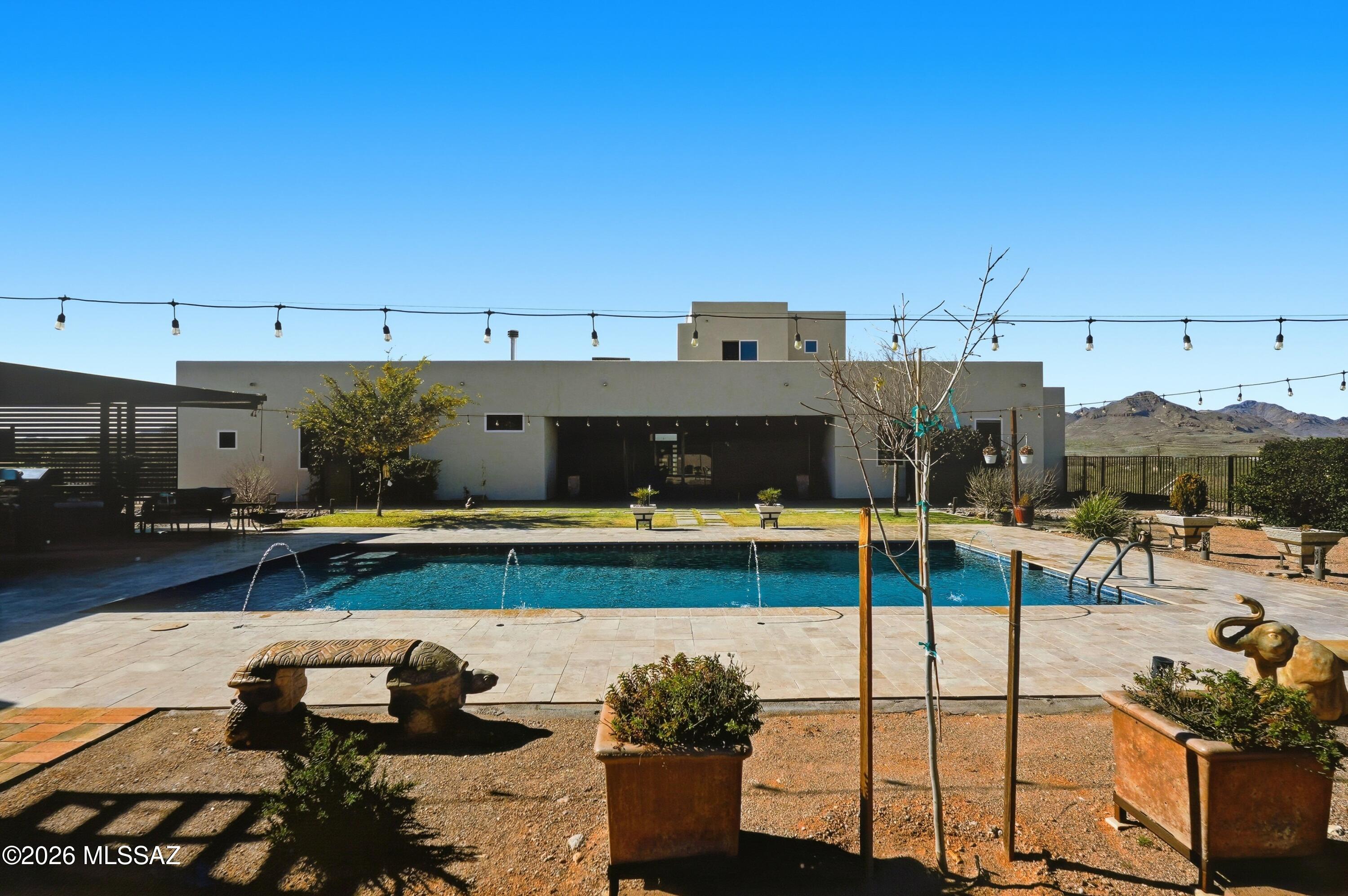 Gorgeous custom built high end home offers 3,751 sq ft of exceptional design plus   pool and casita. Step into the attractive entry and appreciate the high ceilings, open floor plan, and quality finishes throughout. Impressive chef's kitchen includes marble counters, a large center island with sink, breakfast bar, double oven, gas stove with pot filler, deep sink, pull out shelving and abundant counter space. Upstairs a large bonus area serves as family room, game room or office, complete with a private balcony to take in the mountain views. Split bedroom layout provides privacy, with each bedroom featuring its own bathroom. Wow! the primary bath is fantastic! 
Enjoy the sparkling pool with fountain jets, Ramada w/ BBQ, granite counters and ample space for cooking.