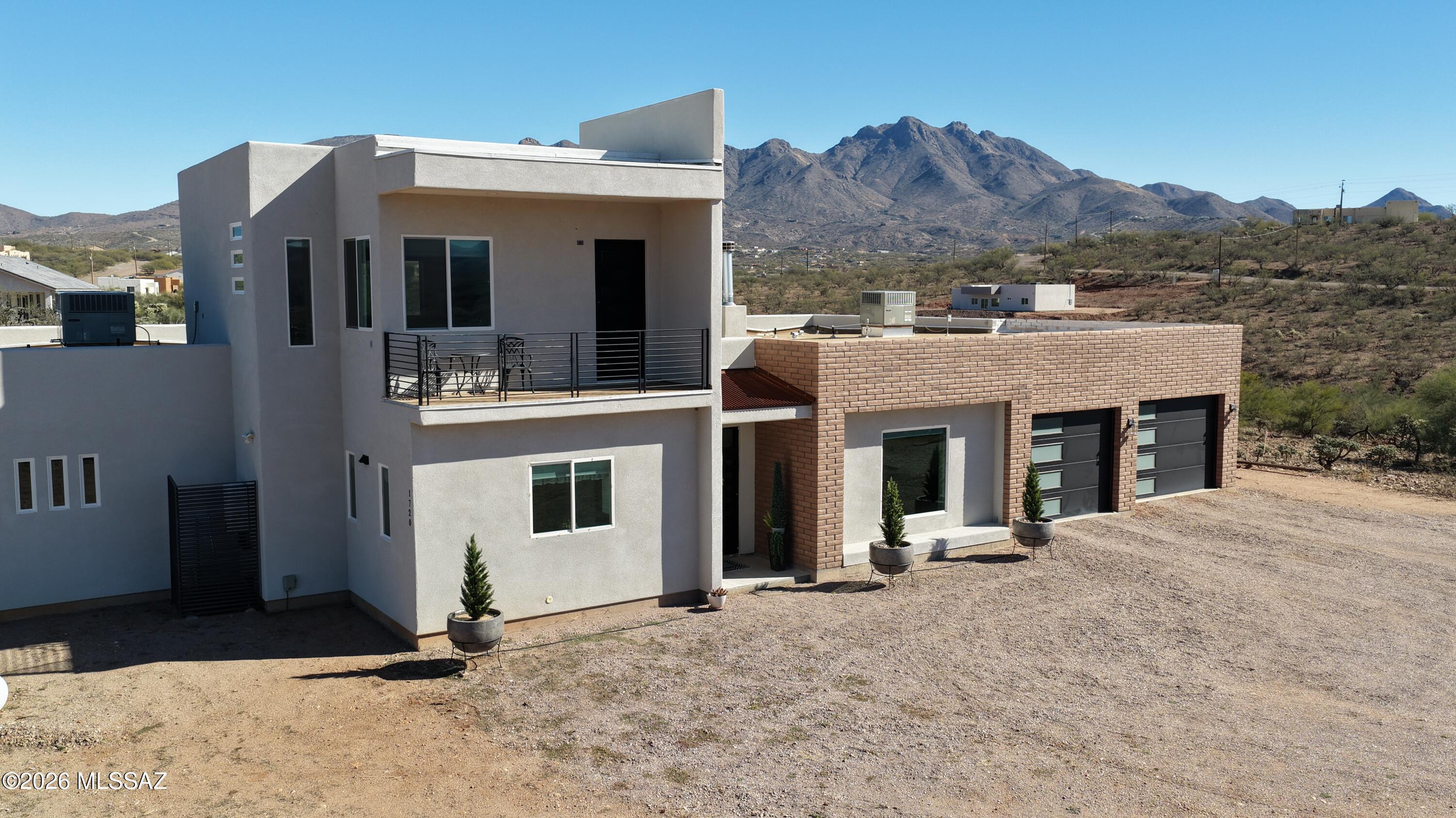 Gorgeous custom built high end home offers 3,751 sq ft of exceptional design plus   pool and casita. Step into the attractive entry and appreciate the high ceilings, open floor plan, and quality finishes throughout. Impressive chef's kitchen includes marble counters, a large center island with sink, breakfast bar, double oven, gas stove with pot filler, deep sink, pull out shelving and abundant counter space. Upstairs a large bonus area serves as family room, game room or office, complete with a private balcony to take in the mountain views. Split bedroom layout provides privacy, with each bedroom featuring its own bathroom. Wow! the primary bath is fantastic! 
Enjoy the sparkling pool with fountain jets, Ramada w/ BBQ, granite counters and ample space for cooking.
