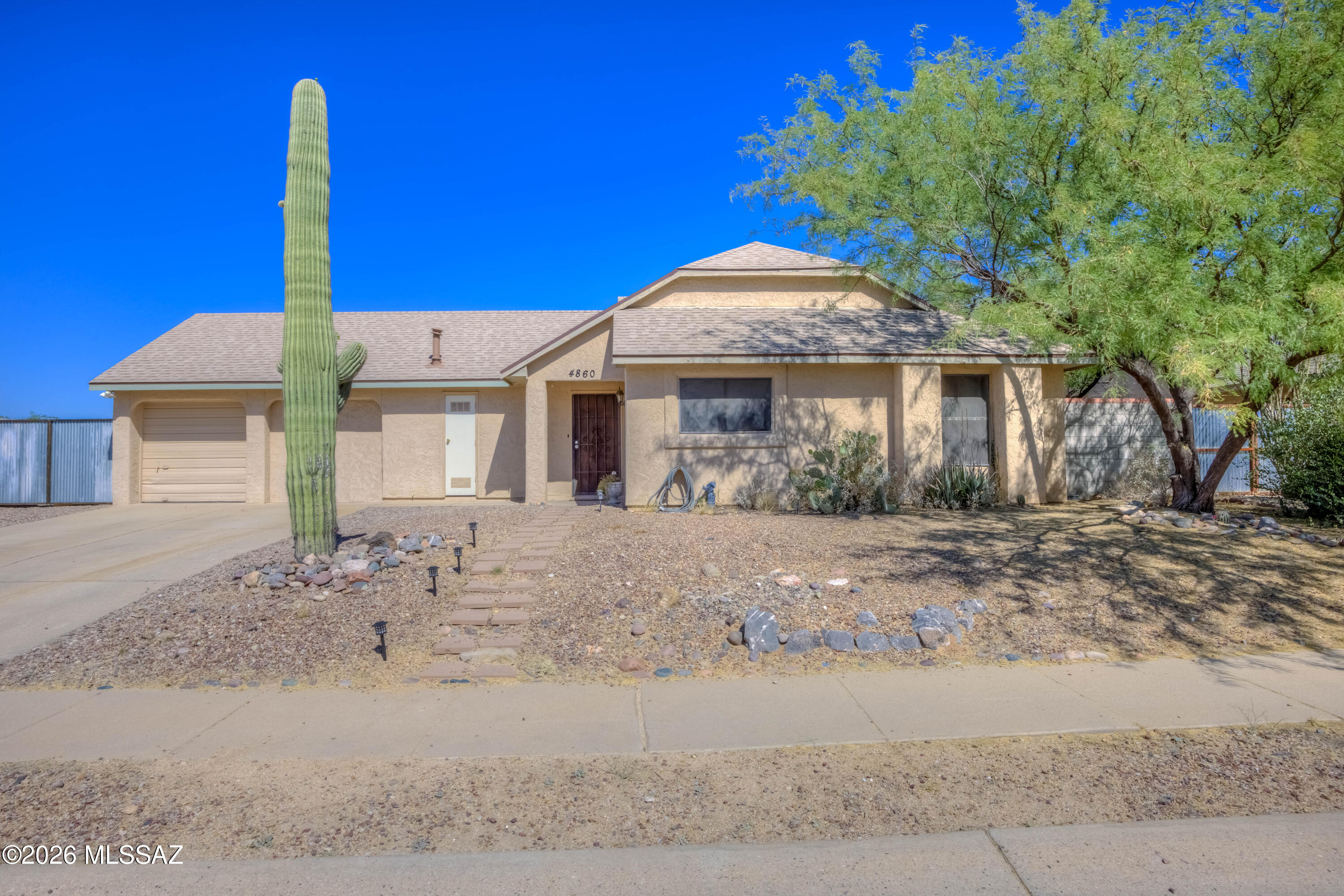 Welcome to this charming beautiful home located in a desirable Northwest community. This property offers comfort, space, and convenience, perfect for everyday living. Enjoy easy access to shopping and dining at nearby Arizona Pavilions, as well as parks, schools, and I-10 for a quick commute. Surrounded by beautiful desert landscapes and mountain views, this area blends tranquility with accessibility. Whether you're relaxing at home or exploring all that Northwest Tucson has to offer, this location delivers the ideal Arizona lifestyle. New Water Heater April 2023, New Roof July 2023, Water Repipe May 2024