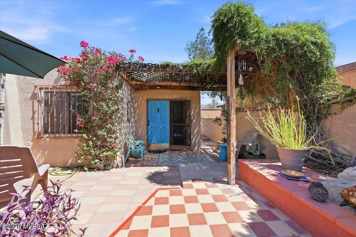 GUEST HOUSE! Experience a one-of-a-kind Tucson property that blends character, functionality, and income potential with a guest house or multi-generational living accommodation. Enjoy proximity to Tucson's notable bike loop, the University of Arizona, shopping, and popular restaurants, all just moments from your doorstep. This charming home welcomes you with a gated front courtyard encompassing a water feature, landscaping, a covered patio, and spacious outdoor living areas that connect the main residence and guest house. The main house offers 2 bedrooms and 1 bath- with a new water heater, refrigerator, oven & stove while the private guest house includes 1 bedroom and 1 bath with new a/c units-- and each with its own laundry facilities. Main house includes basement/flex-room. Guest house rents for $1200-$1500/mo, and is currently rented on a month-to-month basis.