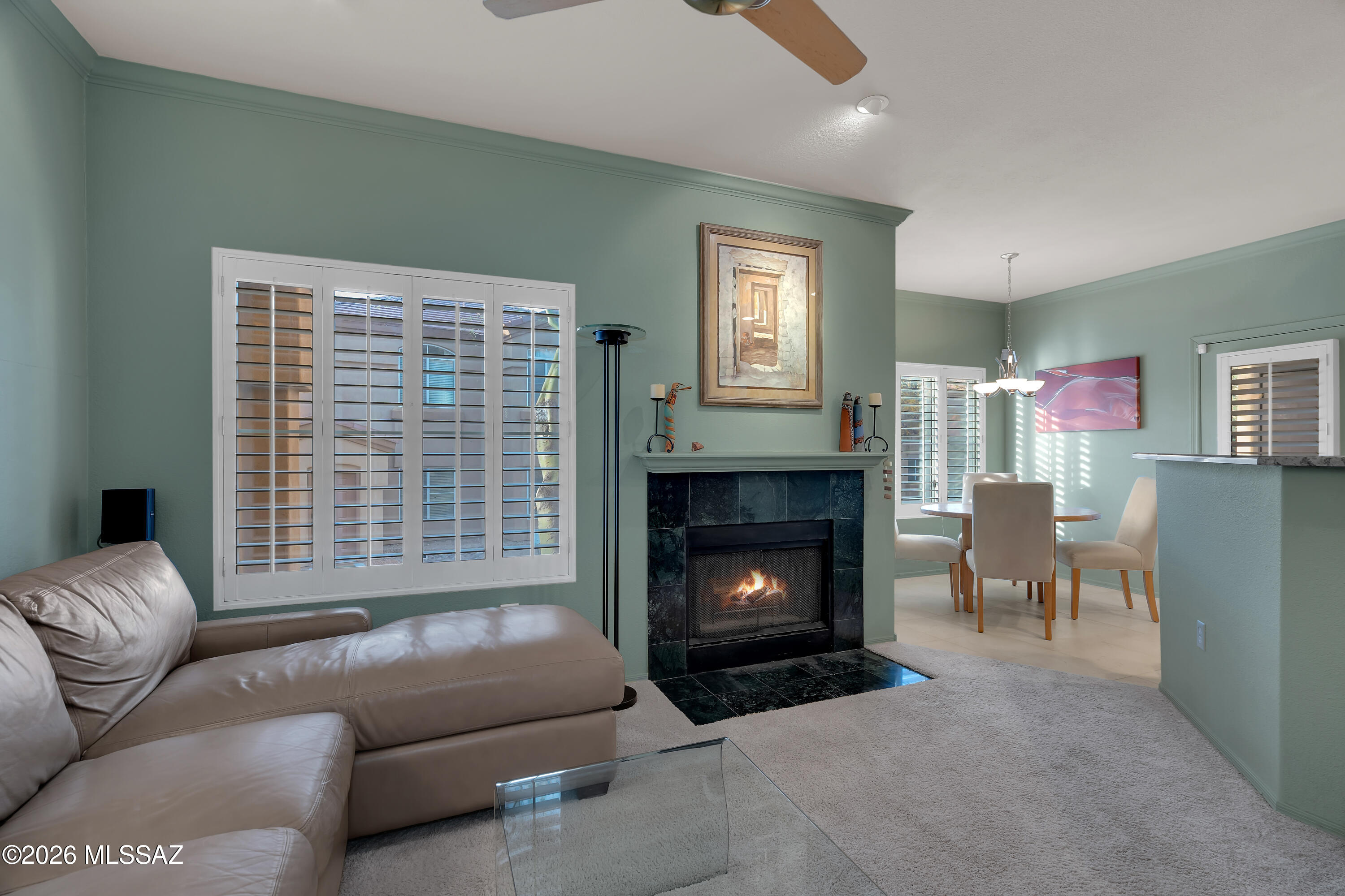 Quaint, well-maintained, Pinnacle Canyon condo in the heart of the Catalina Foothills.  This 1,048 square foot 2B/2B gem boasts granite countertops, stainless steel appliances, recessed lighting, a gas fireplace, and newer kitchen cabinets as well as plantation shutters throughout.  The only unit on the market with a coveted full detached garage!  Perfectly situated in the award-winning Catalina Foothills A+ school district, and just a few miles from the Sabino Canyon Recreation Area, Canyon Ranch Resort/Spa, world-class hiking/biking, fine dining/shopping, and golf.  Amenities include gated entry, heated Pebble Tec resort-style pool and spa, exercise facility, and EV charging stations.  Don't miss this unique opportunity to own a personal slice of Foothills paradise!