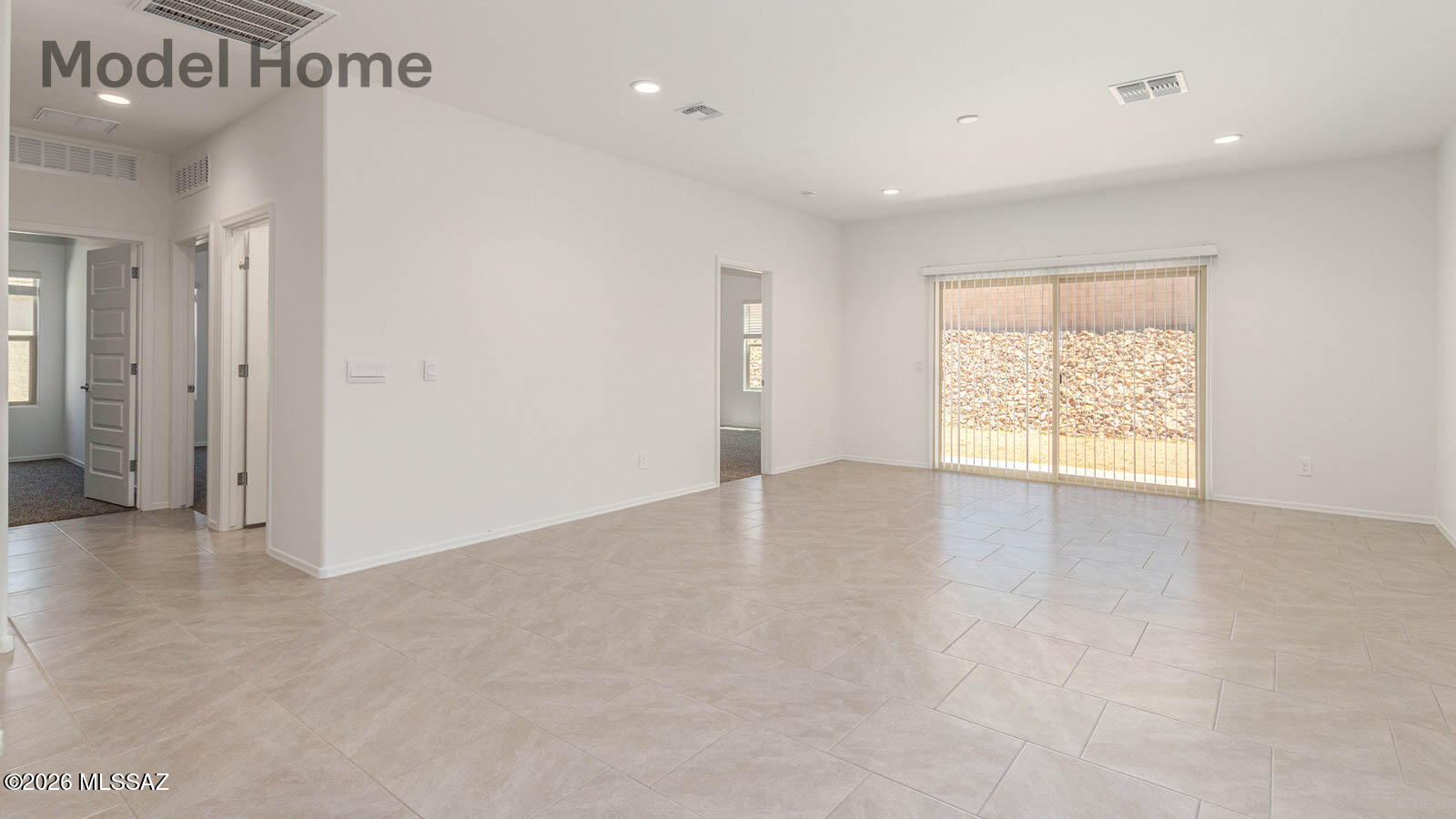 This floor plan offers 1,635 square feet of well-planned living space, perfect for those who appreciate both comfort and functionality. With four bedrooms, two bathrooms, and a 3-car garage, The Elgin provides the ideal setting for modern living amidst the beauty of the Santa Rita Mountains.

As you enter through the inviting front porch, you're welcomed by an open and airy floor plan that flows effortlessly from one room to the next. The heart of the home is the expansive great room, seamlessly connected to the dining area and kitchen, making it ideal for everyday living and entertaining. The kitchen is a chef's delight, featuring a large island with a breakfast bar, quartz countertops, and Shaker-style cabinetry, offering ample storage and workspace.