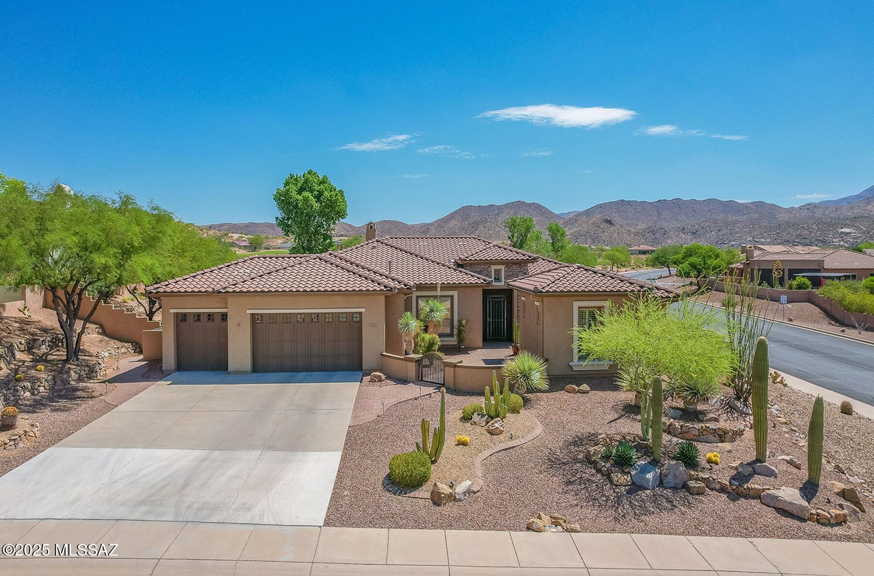 EXQUISITE LUXURY HOME resides on a Premium View Lot in the coveted PRESERVE at SaddleBrooke boasting Panoramic Golf Course and Catalina Mountain Views. Popular Sabino plan on corner lot offers 2,664 sq ft of living space in main home comprising dual Ensuite Bedrooms, Den/Office and Powder Room. Private, detached 285 sq ft Casita off gated courtyard is ideal for additional guests. This elegant Open Concept Plan showcases recessed ceilings, bay windows, faux paint accents, Luxury Vinyl Plank flooring with carpeted bedrooms, plus stone pavers front & rear. Great Room is highlighted by distinct Living & Dining areas, built-in Media wall, Fireplace and View Windows. Expansive Gourmet Kitchen hosts dual islands with breakfast bars, large breakfast nook, rich hued cabinetry, Quartz countertops, Stainless appliances (dual ovens, microwave, 5-burner gas cooktop) plus walk-in pantry. Main Primary Suite with patio access hosts an updated bath with split dual vanities, soaking tub, tiled walk-in shower and custom walk-in closet. Extended laundry with storage cabinets & sink plus 3 car garage offering plentiful storage and water softener. Additional amenities include gated front porch entry, security system & lights, surround sound, zoned heating & cooling, instant hot water, drip irrigation plus newer Roof, A/C units and Mini Split, Refrigerator/Washer/Dryer, interior Lighting, exterior paint and more! Retreat outdoors to a magnificent setting featuring covered and uncovered patios, kiva fireplace with banco seating, tiered fountain, meticulous landscaping and exceptional views. Highly desirable SaddleBrooke 55+ Active Adult Community offers countless amenities including golf, fitness center, pool & spa plus so much more!
