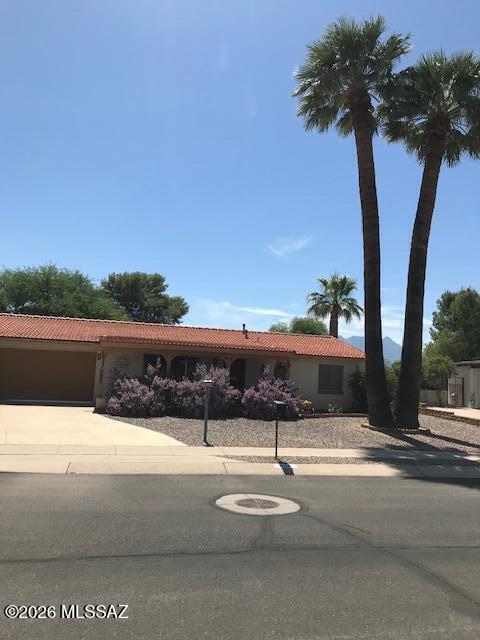 LOCATION! LOCATION!! LOCATION!!! Enjoy a serene setting beside an alley that leads to Desert Meadows Park, the renowned De Anza Trail, and the Santa Cruz River. This charming 2-bedroom, 2-bath home features a 2-car insulated garage, newer HVAC, roof, range, and washer dryer, fresh interior paint, stained concrete floors, pergola-covered patios, and beautiful mountain views. This inviting desert retreat is ready to welcome you home.