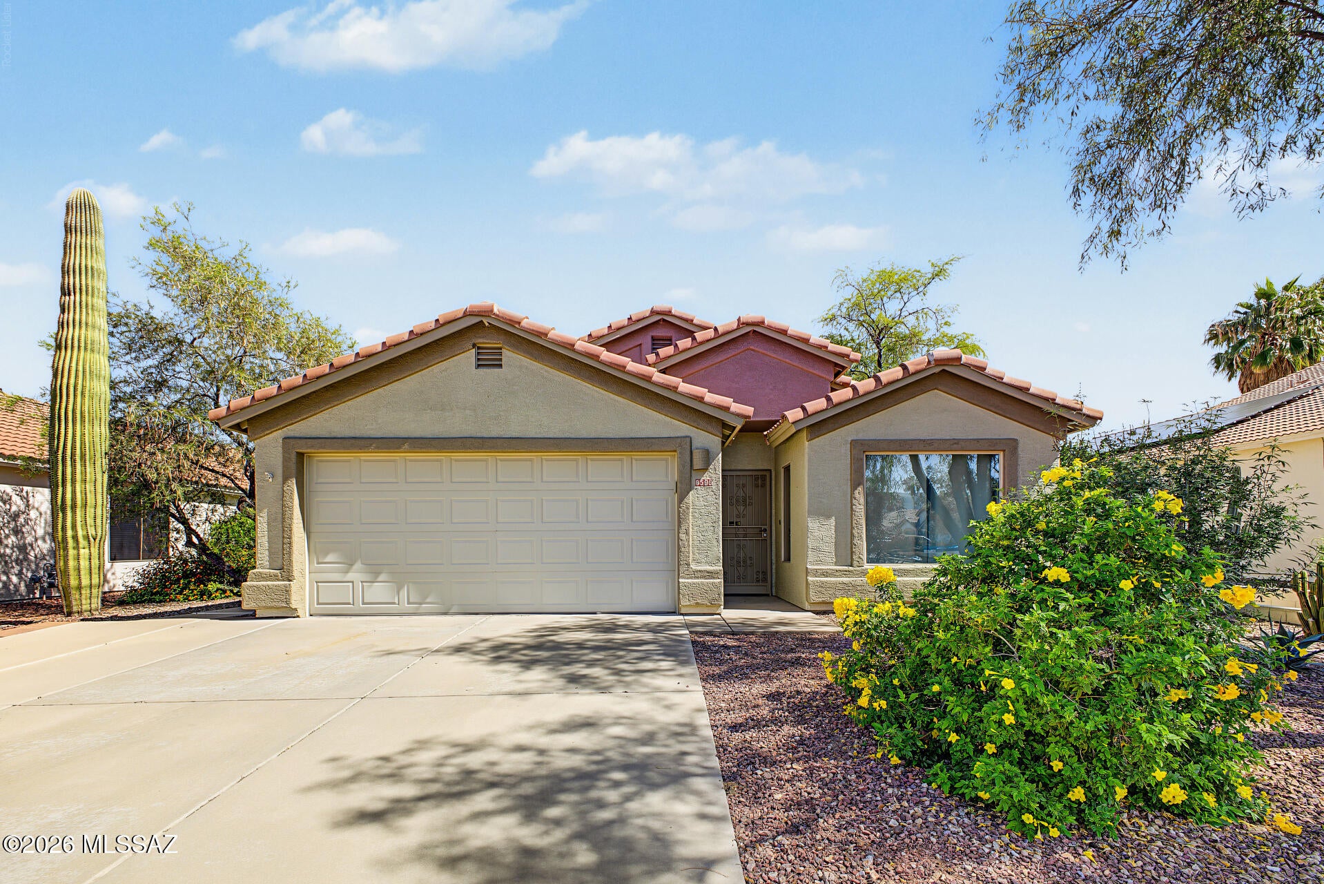 Remarkable and incredible views! Back yard river walk access! This is a well appointed 1632' 3 bed 2 bath home with a fireplace, living room and family room. beautiful back patio area with endless unobstructed views. Equipped with beautiful granite counter tops in the kitchen as well as a primary bathroom that has undergone a high end remodel! beautiful updated tile throughout and high ceilings really give this place a nice open feel. Walk out the back door on to the Santa Cruz River walk for a run, bike ride or a evening stroll. Bring your buyers to come check out this gem of a home.