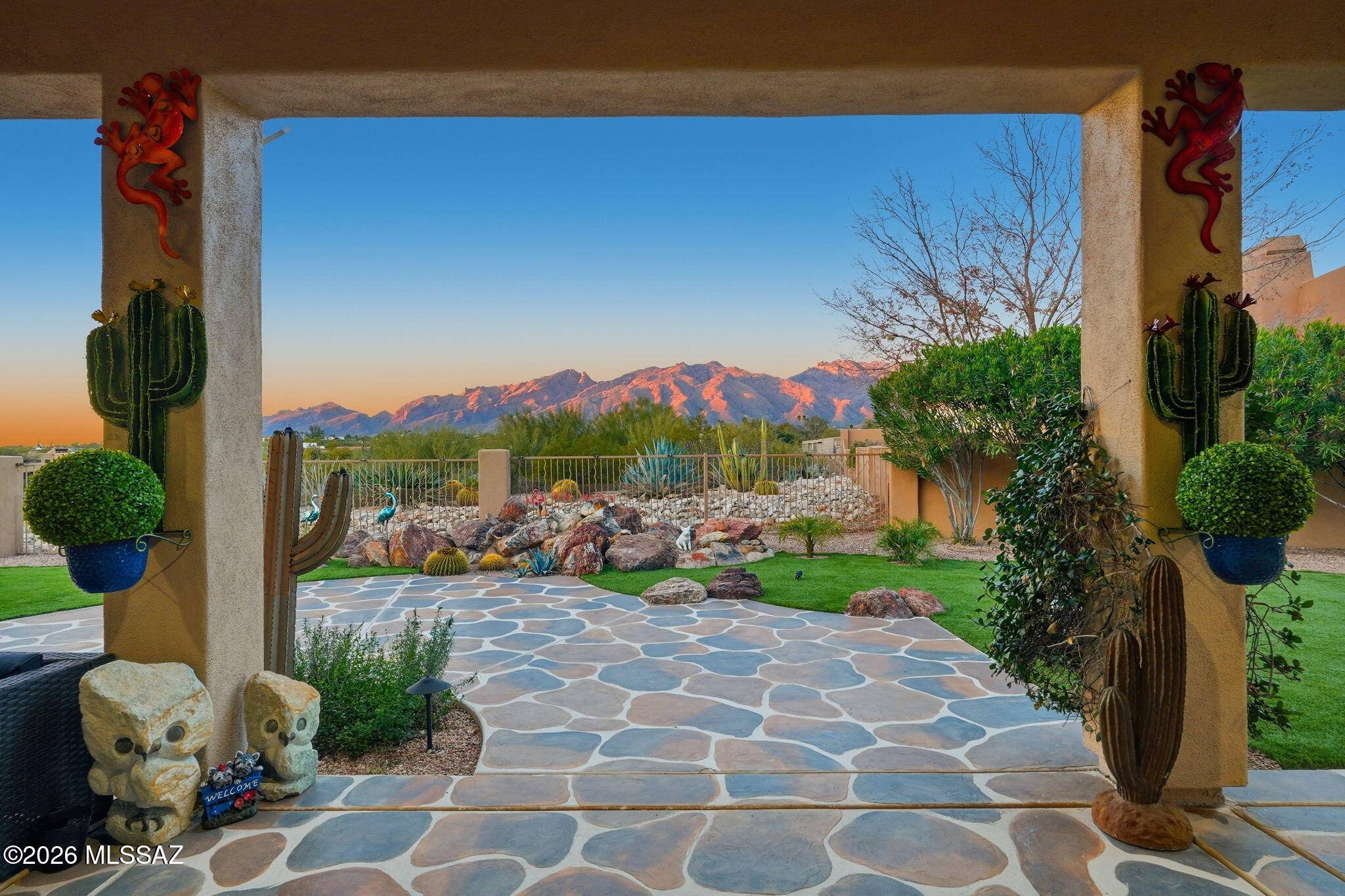 Beautifully updated and move-in ready, this home showcases sweeping mountain views and a bright, open floorplan.. Wood-look tile flows throughout, complemented by updated fans, contemporary lighting, newer windows and fresh interior and exterior paint. The stylish kitchen features newer appliances, a double oven and gas cooktop, along with generous counter space for cooking and entertaining. The spacious Owner's Suite offers a custom closet and a newly remodeled shower with an elegant tile surround. Outdoor spaces feel fresh and easy to maintain with updated landscaping, artificial turf, and citrus trees. A 3 car garage has an epoxied floor and built-in storage.  Located within a desirable gated neighborhood close to shopping, dining, and the Loop Trail.  Not to be missed!