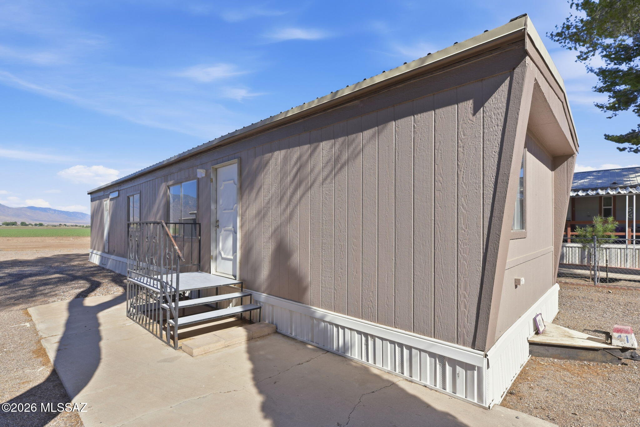 Welcome to this charming 2-bed, 1-bath manufactured home located in the Safford Ranch Mobile Home Park, a 55+ community! This home recently underwent extensive renovations, making it feel like a brand-new home, offering great mountain views! The home features all-new appliances, an electric water heater, updated bathroom fixtures, and new heating/cooling MiniSplit units. Residents can enjoy the park's clubhouse and pool, with abundant trees providing ample shade throughout the area.
The park is perfect for those seeking a peaceful retirement lifestyle among like-minded individuals. All new residents must be approved by park management. Don't miss out on this opportunity & schedule a showing today!