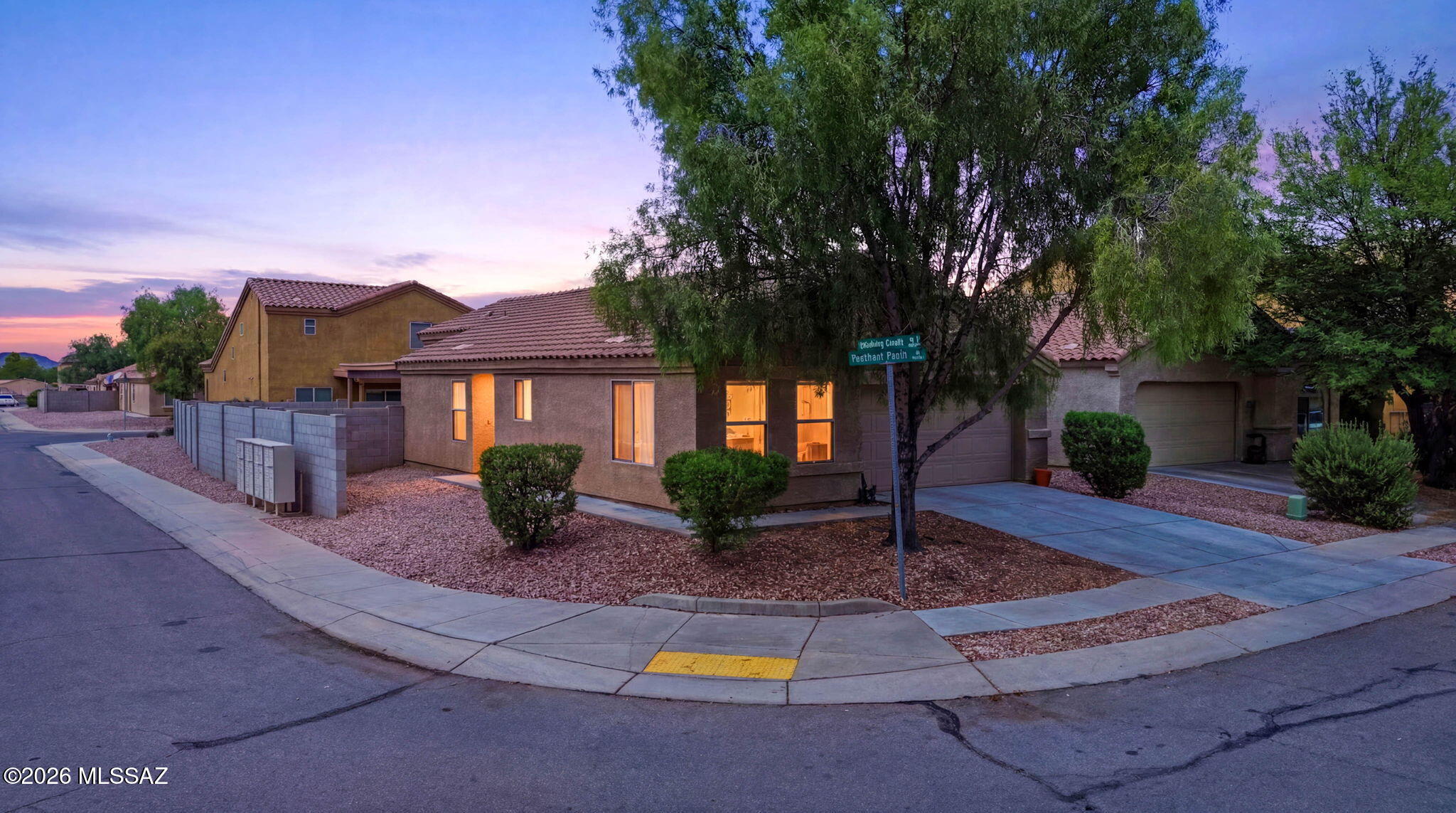 Welcome to this well-maintained 3-bedroom, 2-bath home situated on a desirable corner lot in the popular Midvale Park community! This inviting single-story home features a bright, open-concept floor plan with spacious living and dining areas, perfect for everyday living and entertaining. The split-bedroom layout offers added privacy, with a comfortable primary suite featuring an en-suite bath and generous closet space. Enjoy a low-maintenance backyard with plenty of room to relax or entertain. **Leased solar panels help provide energy efficiency and potential utility savings** (buyer to assume solar lease). Conveniently located near parks, schools, shopping, dining, and easy access to I-19, Davis-Monthan AFB, Raytheon, and downtown Tucson. A fantastic opportunity to own a move-in-ready home in a great location!