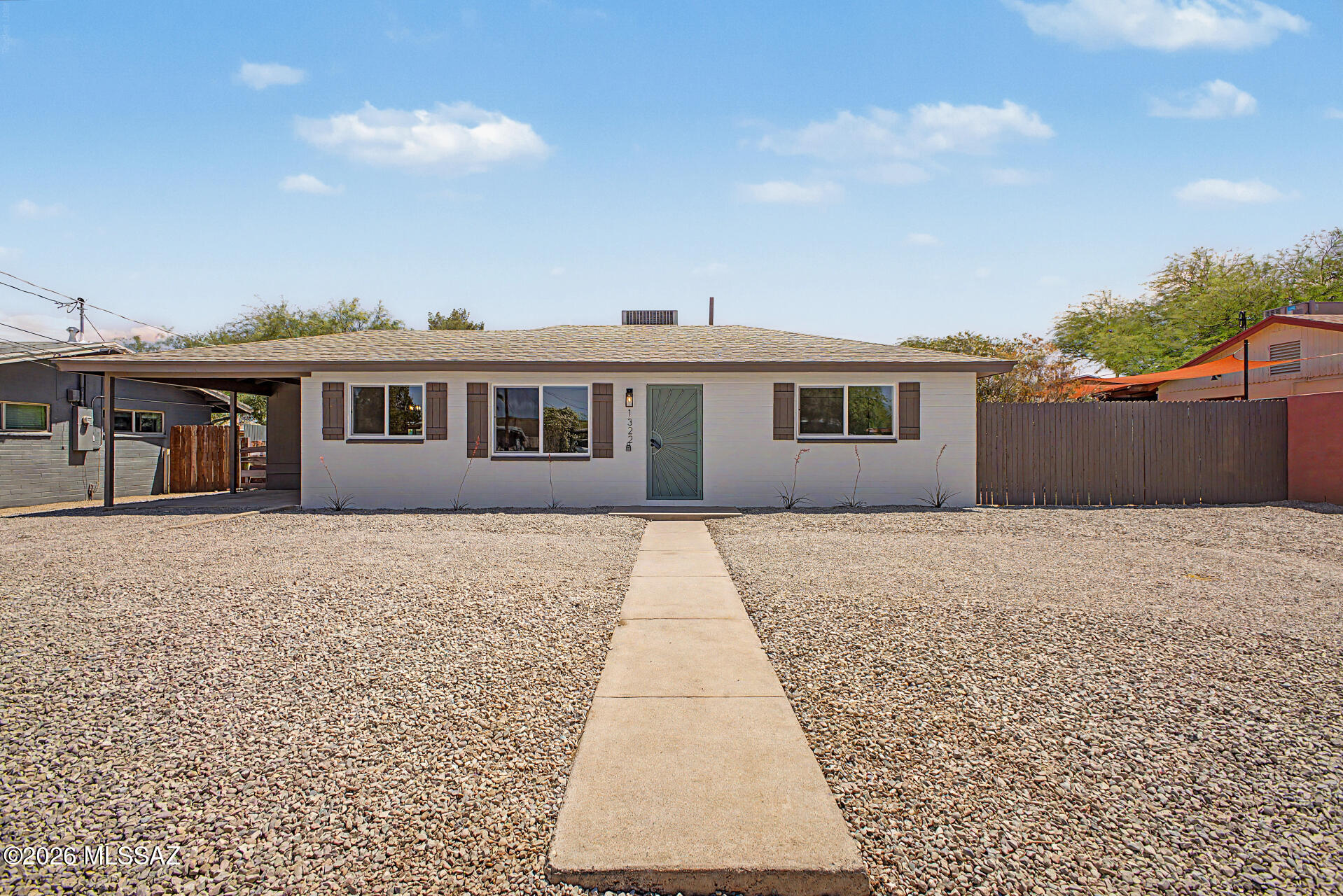 Seller will counter or accept offers between $269,000 - $279,000. Updated single-family home in the Avondale neighborhood of Midtown Tucson! This move-in ready property features luxury wood-look plank flooring, plush carpet in the bedrooms, and modern electrical and plumbing fixtures throughout. The kitchen offers quartz countertops, light brown cabinetry, a neutral tile backsplash, and stainless steel appliances. Additional upgrades include new windows, a new AC system, and a new roof. Fresh interior and exterior paint complete the home. Conveniently located in central Tucson--this is a must-see!
