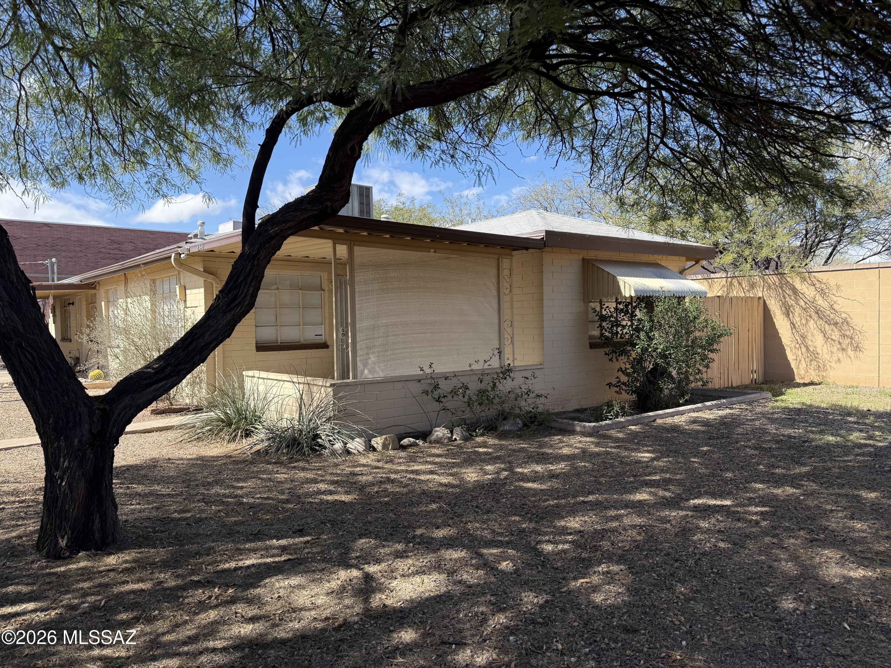 Only 1 mile to the UofA, just 3 minutes driving time. 2 connected units and is classified as duplex per Pima County Assessor. VERY SECURE COMPLETELY WALLED-IN AND GATED OASIS on low traffic residential street includes 1-2 bd/1ba 750 sq ft unit and one 1bd/1ba 547 sq ft. Each unit has all tile floors, central air conditioning, ceiling fans in bedrooms and covered secure parking. Each unit also has an individual washing machine, in the small utility room next to the kitchen & a separate outside locked storage unit with a dryer. AC in 2 bedroom unit was installed in June 2021. 1 bd rented for $750.00 per month. Each unit is individually metered for gas and electricity. Landlord pays water. 2 BD. lease expires 5/31/26 and rented for $1050. per month. AWESOME LOCATION AND PRICED TO SELL!