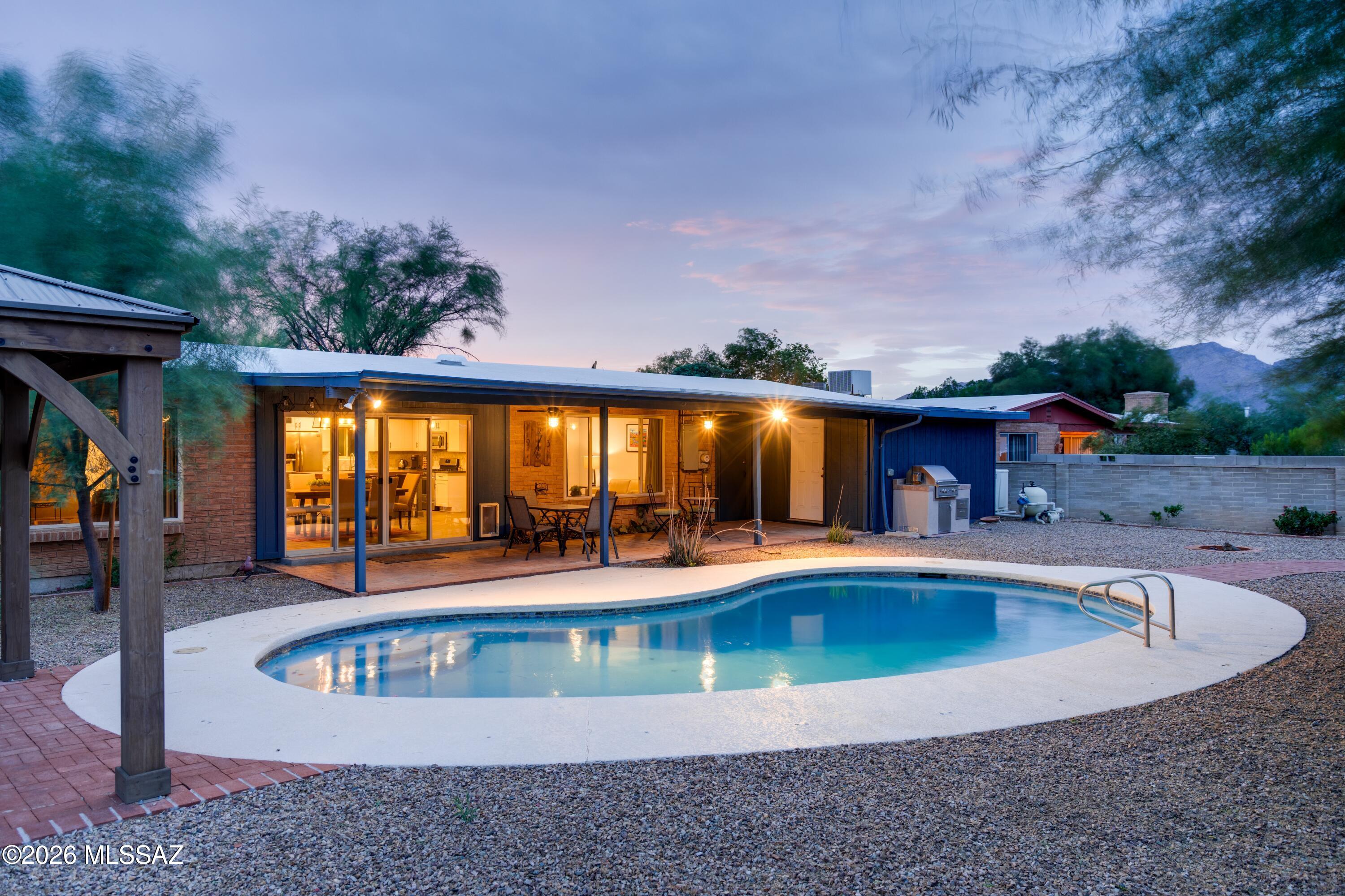 Move in and relax. This corner lot home with Mtn views has quality finishes throughout. The updated kitchen features a custom mesquite island, gas range, quartz countertops, farmhouse sink, and custom backsplash. The open space of the kitchen, dining, and living room flows out onto the shaded patio and fresh pool, making a year-round retreat. A separate family room offers flexible living space, and both the ensuite primary and 2nd bathrooms are fully updated. The current owners' upgrades: heat pump package HVAC, pool pump and heater, replastered pool, upgraded electrical, gas water heater, smart thermostat, drip irrigation system, under-sink water filter, and a roof re-coat in March 2026. Fully fenced backyard, built-in BBQ, gazebo, and brick patio. 2-car garage with workspace and storage.