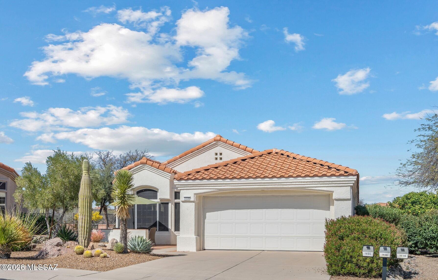 More than charming! This sought-after Sonoran model offers the perfect touch of Southwest character on a Premium Lot showcasing lush desert and mountain views including sunrises and sunsets. Majestic Santa Catalina Mountains create a stunning backdrop from both the inviting front patio and covered rear patio. Inside, find a warm fireplace, spacious dining area, high ceilings, and a desirable split-bedroom floor plan. The expansive primary suite features an impressive bath with custom, one-of-a-kind wood cabinetry that perfectly matches bedroom set and dressers, included with home. Kitchen designed for comfort, filled with windows, light, and more views. Enjoy 2 pools, community gym, golf, pickleball, tennis, bocce, billiards, cycling and107+ clubs, Bistro, and live music and restaurant