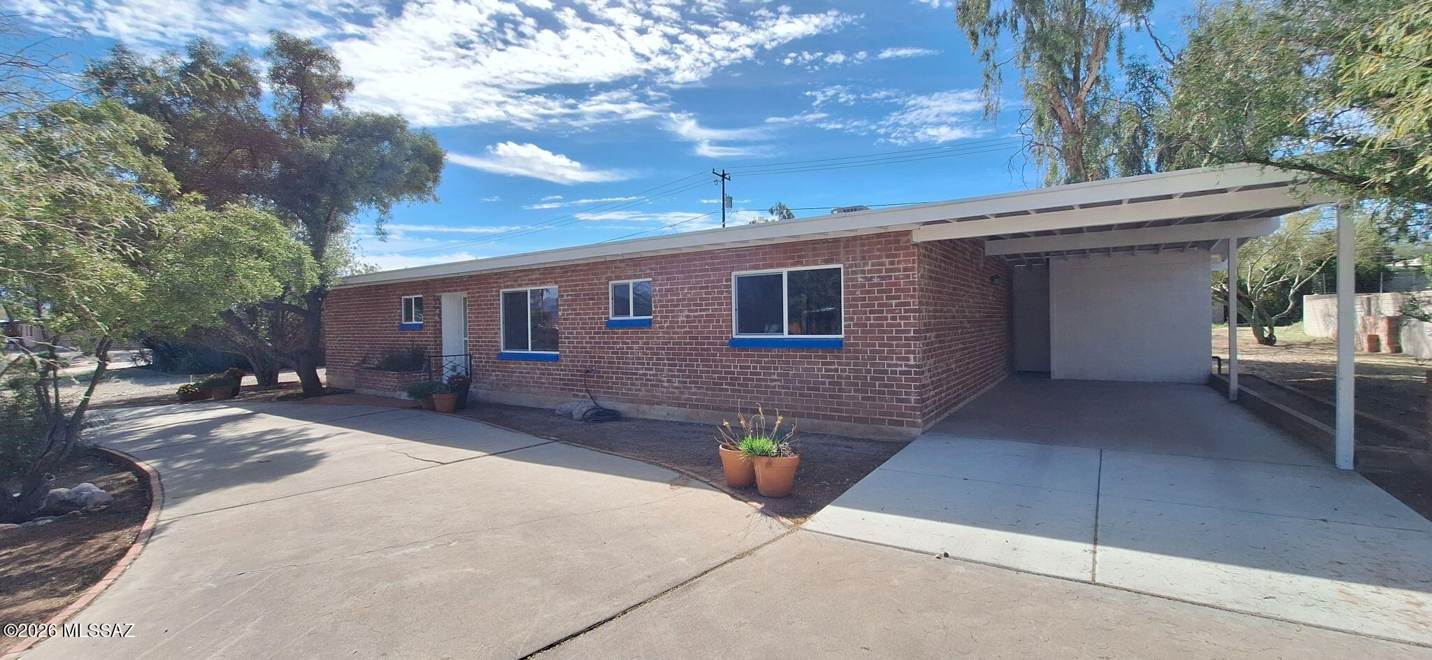 Fully renovated and move-in ready, this stunning 3-bed, 2-bath home on Tucson's desirable Eastside sits on a spacious third-acre lot in a quiet cul-de-sac. Recently updated from top to bottom, it features new flooring, windows, ceiling fans, a modern kitchen with new cabinets, countertops, and appliances, plus two beautifully remodeled bathrooms. Major system upgrades include a brand-new roof (with warranty), plumbing, electrical, HVAC, and power panel. Combining mid-century charm with today's style and efficiency, this bright, open home also offers a large backyard ideal for entertaining or relaxing—close to parks, shopping, and medical facilities.