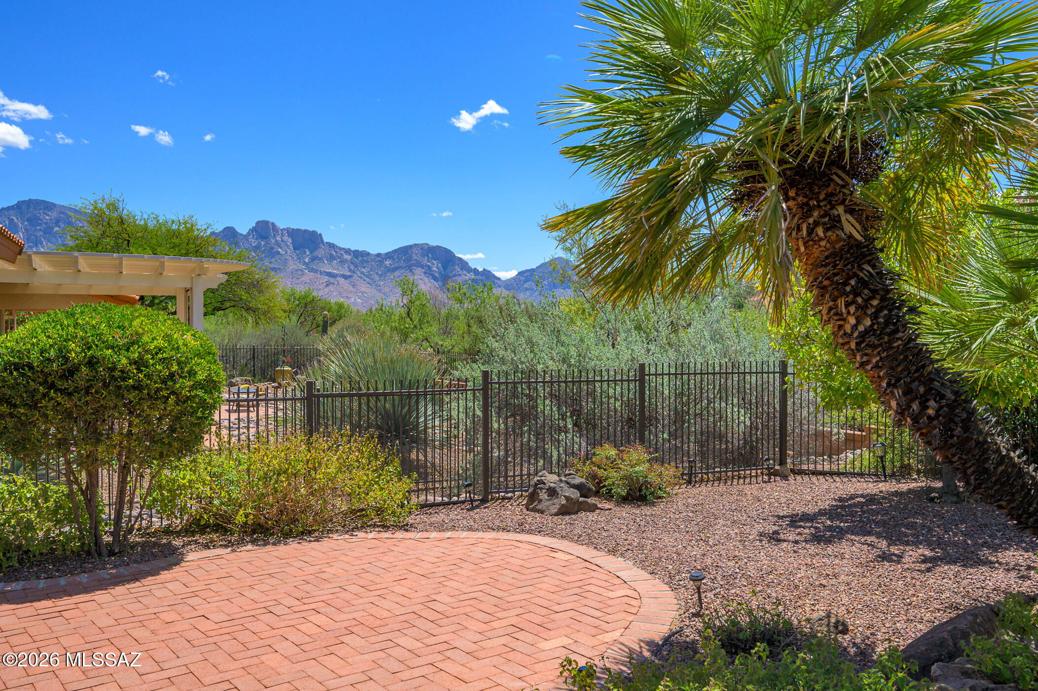 If a gorgeous, updated, turnkey home on a beautiful desert & mountain view lot is what you're looking for, look no further! Upon entering, you'll want to call this wonderful property ''Home''. With beautiful upgrades throughout, high quality furnishings & most of the artwork included, you'll soon be enjoying your new life in the highly desirable community of Sun City Oro Valley. The light & bright kitchen has pretty granite countertops, updated cabinets, stainless steel appliances, separate pantry & breakfast nook overlooking the beautifully landscaped & fully fenced backyard. You'll enjoy Catalina Mountain views from the kitchen, dining nook, living room & the Primary bedroom. Entertaining is easy in the welcoming living & dining rooms. The Primary bedroom boasts a bay window & sliding door to the covered, screened-in patio. The en-suite bath is complete with an updated dual vanity, enlarged & tiled walk-in shower plus a walk-in closet with an upgraded closet system. This home has an expanded guest room with beautiful, custom-built Murphy Bed, matching side dressers & glass-doored cabinets to showcase your collectibles! Add a desk or workspace in front of the windows & enjoy more mountain views! The updated hallway bath is just outside the door for added convenience. This home features tile flooring throughout, 2 solar tubes, electric sun shades, plus the 2, fully enclosed & screened front & back patios, bringing the outdoors in & adding to your living & entertaining spaces. You'll love the mountain views from the front courtyard & the views from the extended back patio. Lovely desert-scape landscaping, mature fruit trees & green-space views from the yard and home are icing on the cake! This move-in ready home combines style, convenience & location - an exceptional opportunity in one of the area's most sought-after communities. Schedule your private showing today!