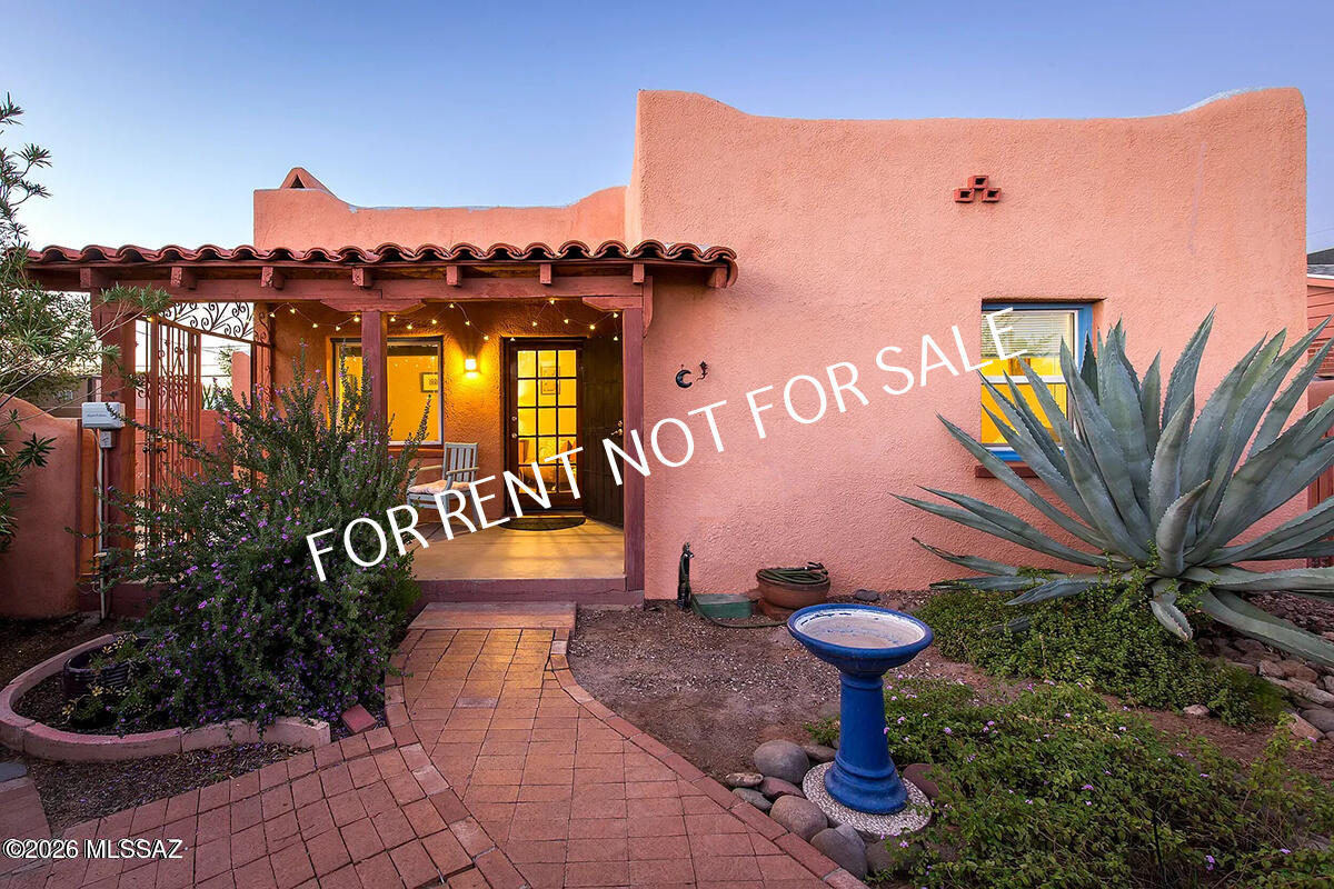 Built 1939 2 BED 1 BATH 1183 SQ. FT.  Tucked away in the heart of central Tucson, this private historic home offers a rare blend of timeless character and quiet seclusion. Property feels like a hidden retreat while still being moments from the city's best dining, shopping, and the University of Arizona! Rich with original charm, the home showcases classic architectural details and warm textures. Natural light fills the living spaces, highlighting the unique character of each room and creating an inviting, lived-in elegance. Fireplace for decorative purposes only. The layout provides both comfort and flexibility, with intimate gathering spaces and peaceful bedrooms designed for rest and relaxation that also include generous size closets. Beautiful Kitchen offers appliances such as refrigerator, gas oven/stove, dishwasher and countertop microwave. Washer/ Dryer included. Outdoors, the property continues to impress with a serene setting perfect for entertaining or enjoying Tucson's beautiful desert climate. With a private front patio and a shared backyard. Garage to be used for storage only. Please watch your steps while entering front and back patios.
$80.00/mo allowance for water/sewer/trash paid by tenant. Other utilities paid by tenant: electric and gas.  NO PETS.
**Please visit our website for SECURITY DEPOSIT AMOUNT, UTILITIES INFORMATION PAID BY TENANT AND OTHER FEES.*
